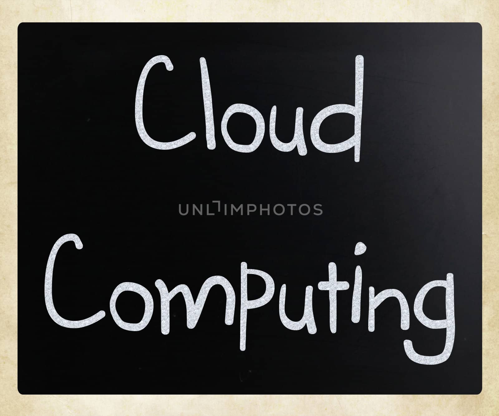 "Cloud computing" handwritten with white chalk on a blackboard