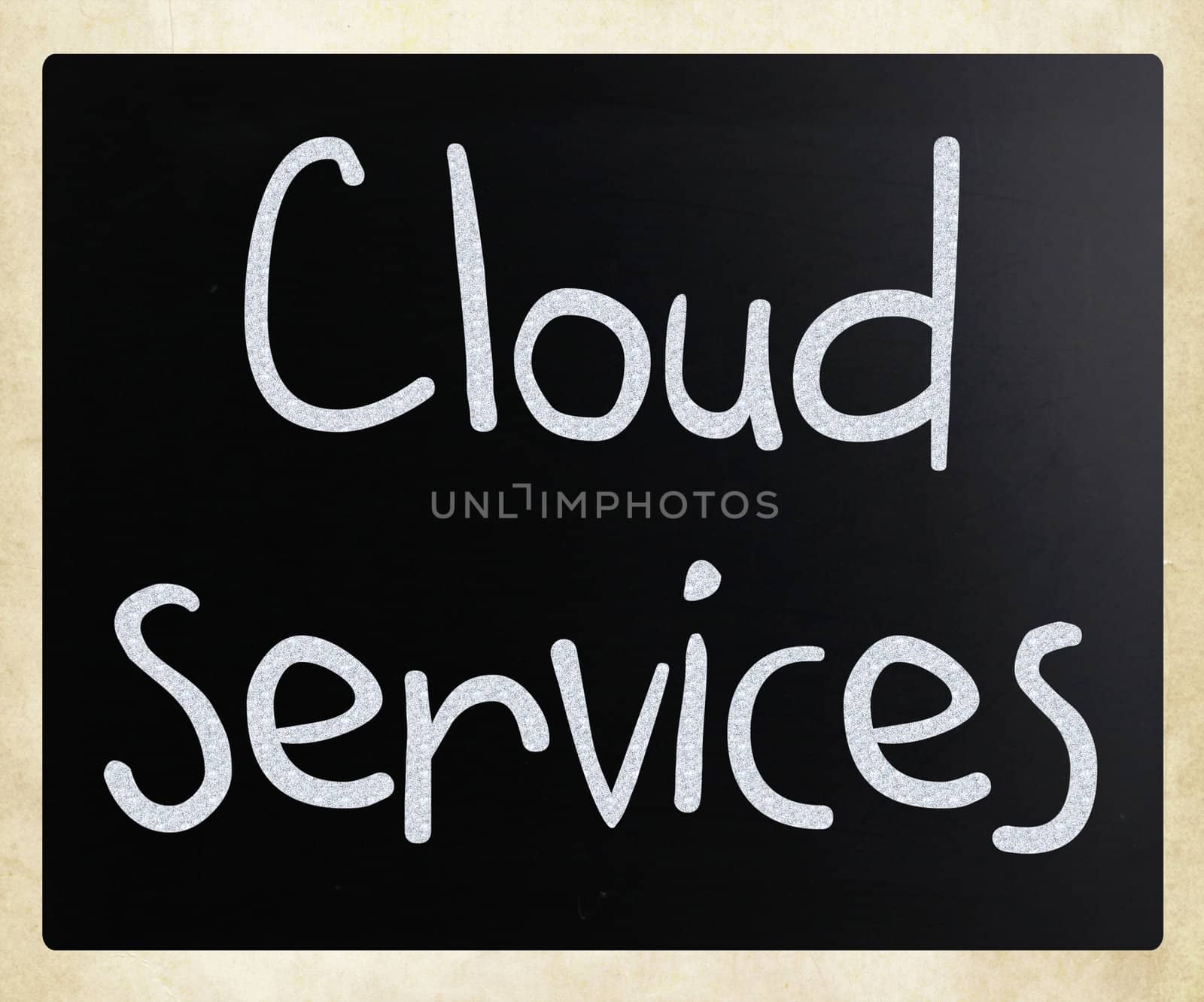 "Cloud services" handwritten with white chalk on a blackboard
