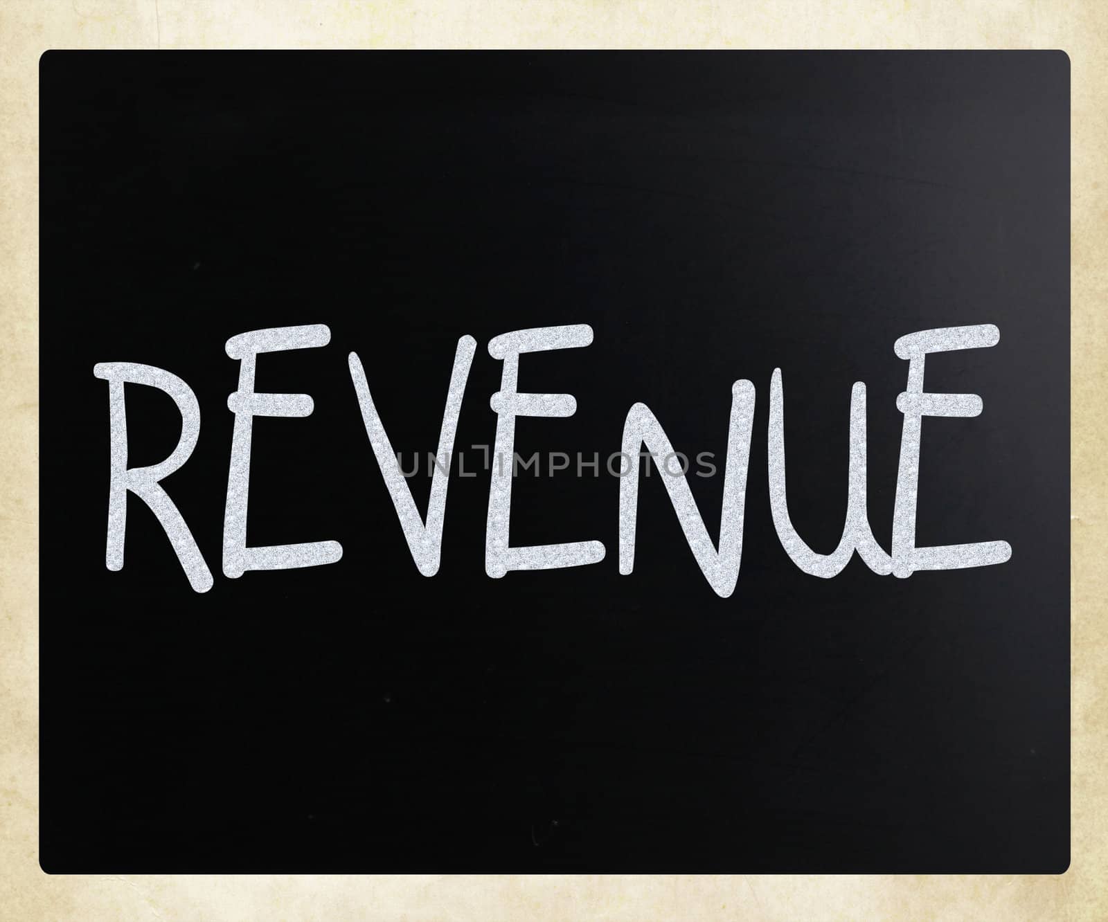 "Revenue" handwritten with white chalk on a blackboard