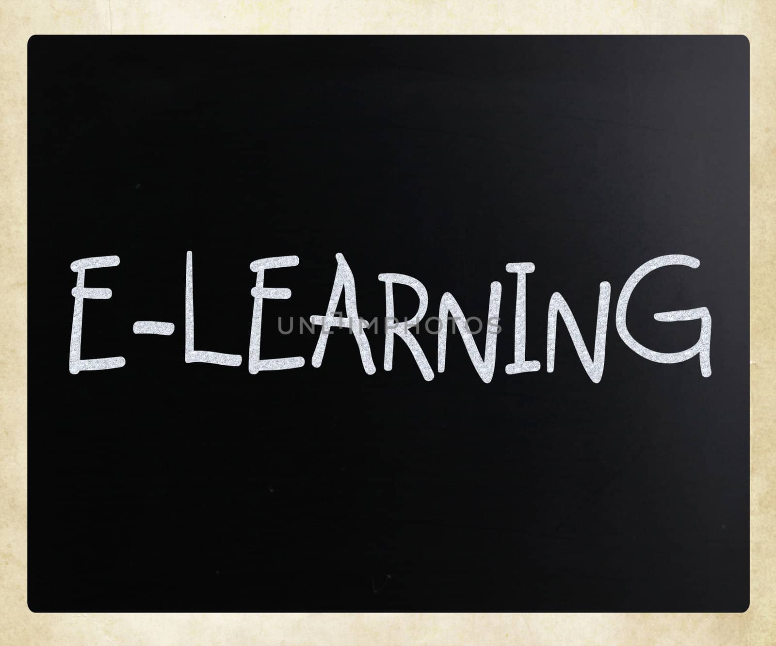 "E-learning" handwritten with white chalk on a blackboard