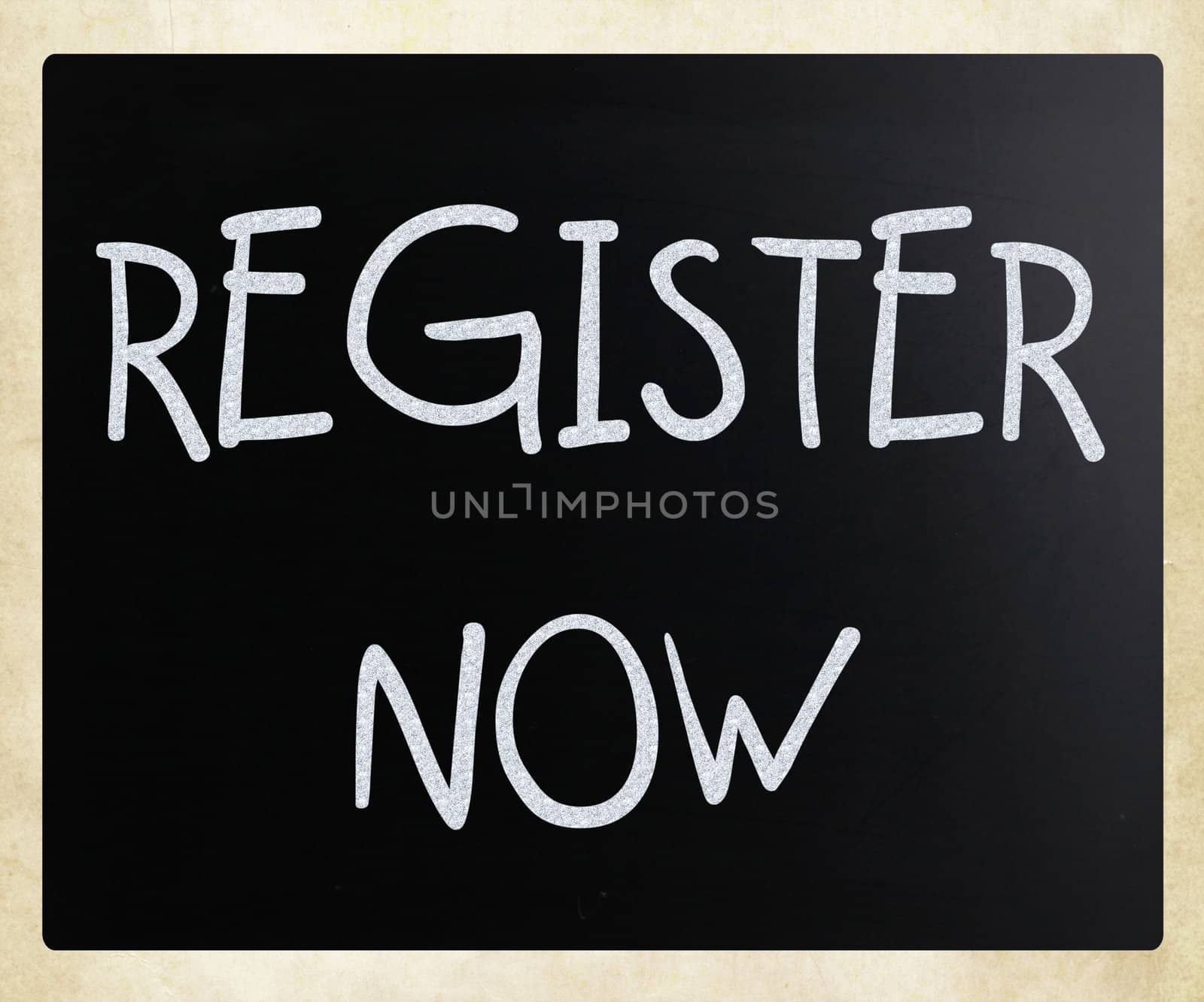 "Register now" handwritten with white chalk on a blackboard