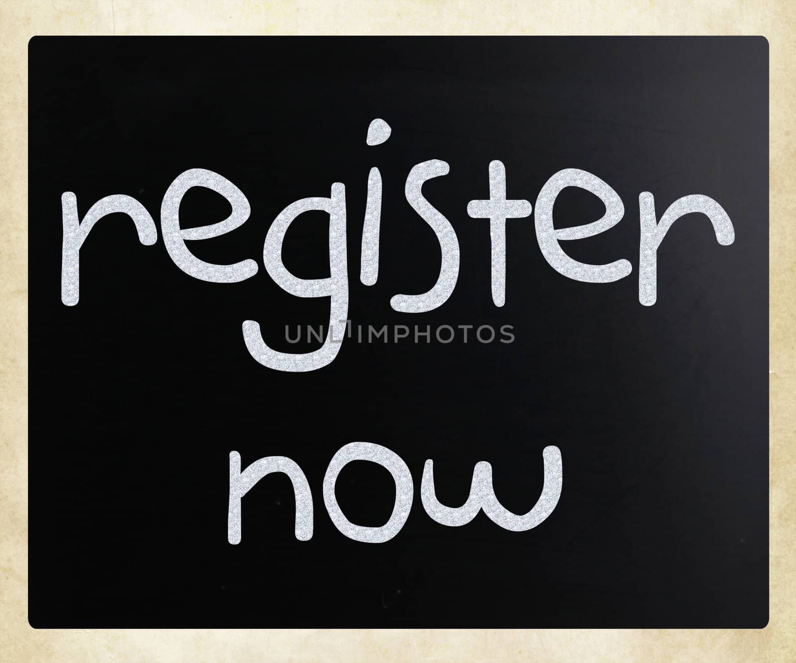 "Register now" handwritten with white chalk on a blackboard