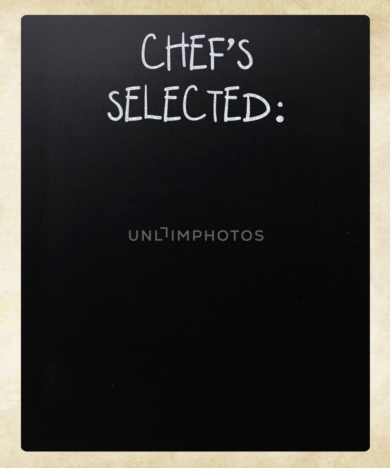 "Chef's Selected" handwritten with white chalk on a blackboard