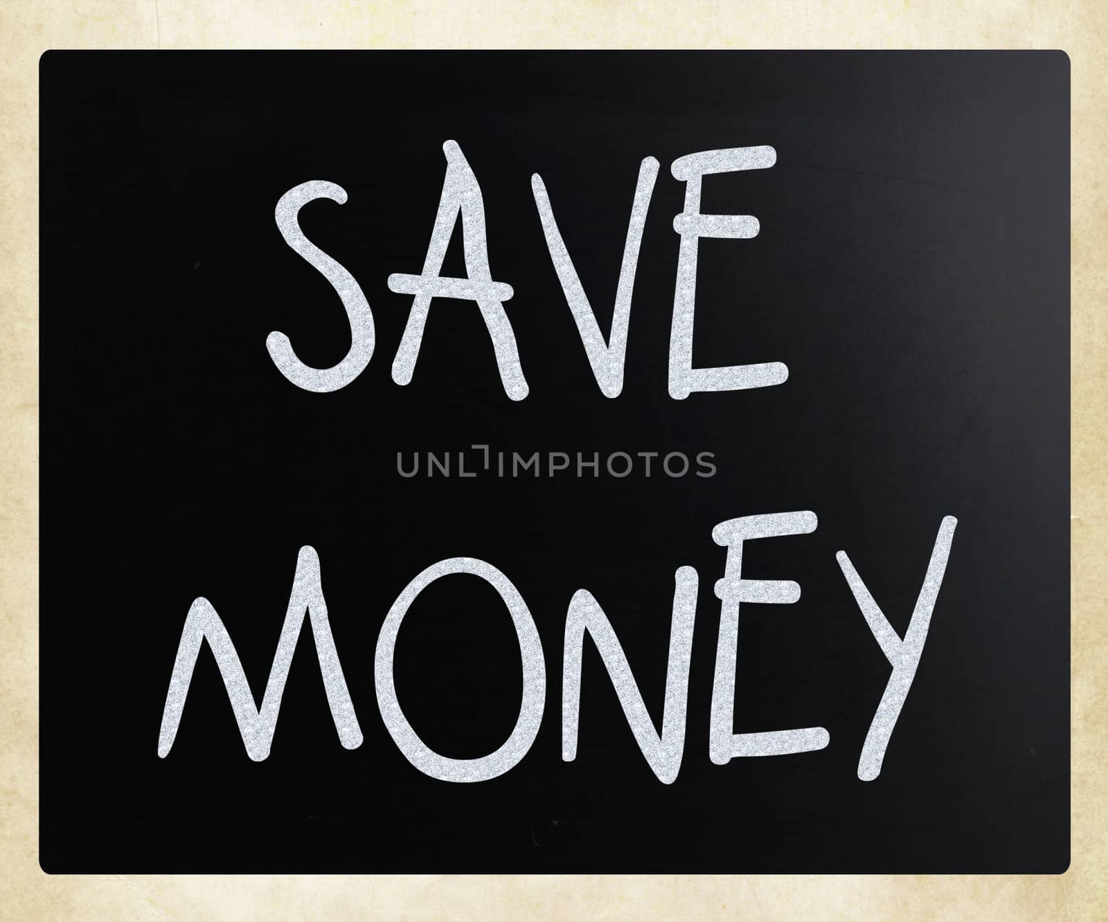 "Save money" handwritten with white chalk on a blackboard