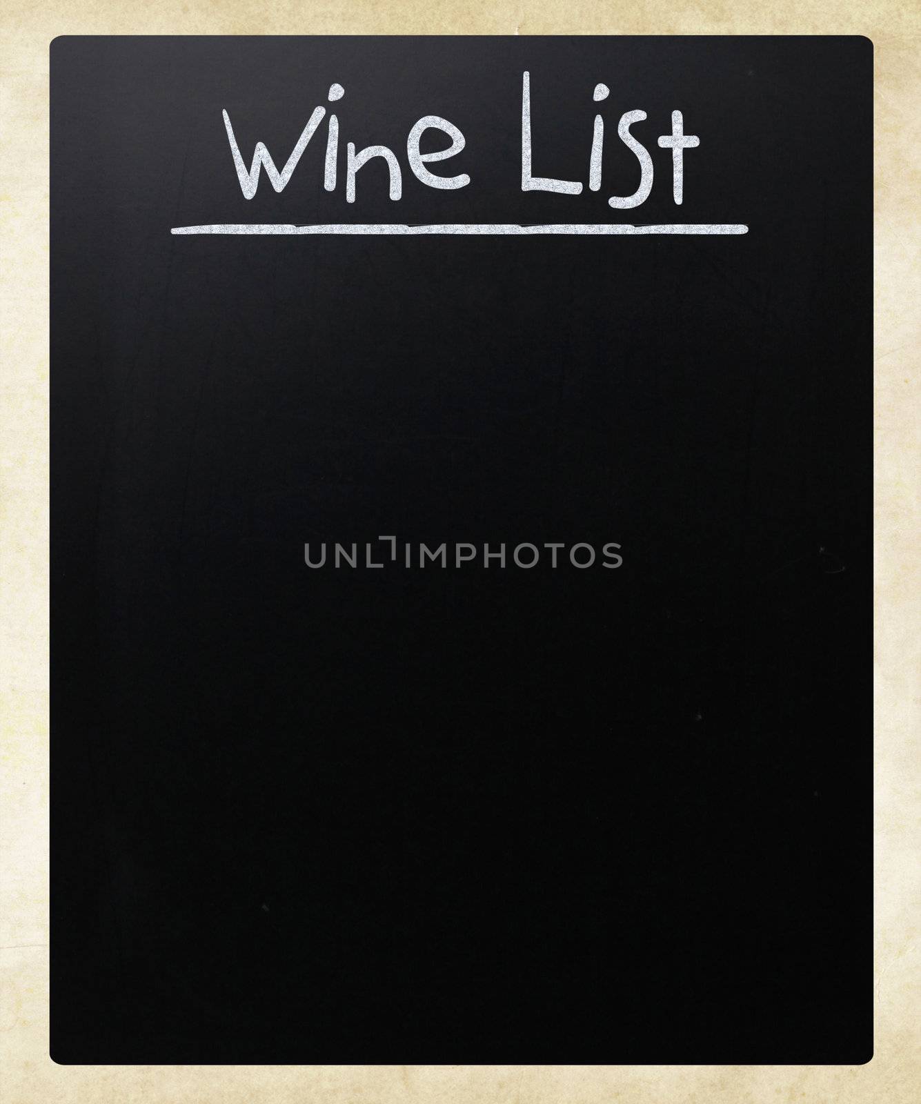 "Wine list" handwritten with white chalk on a blackboard