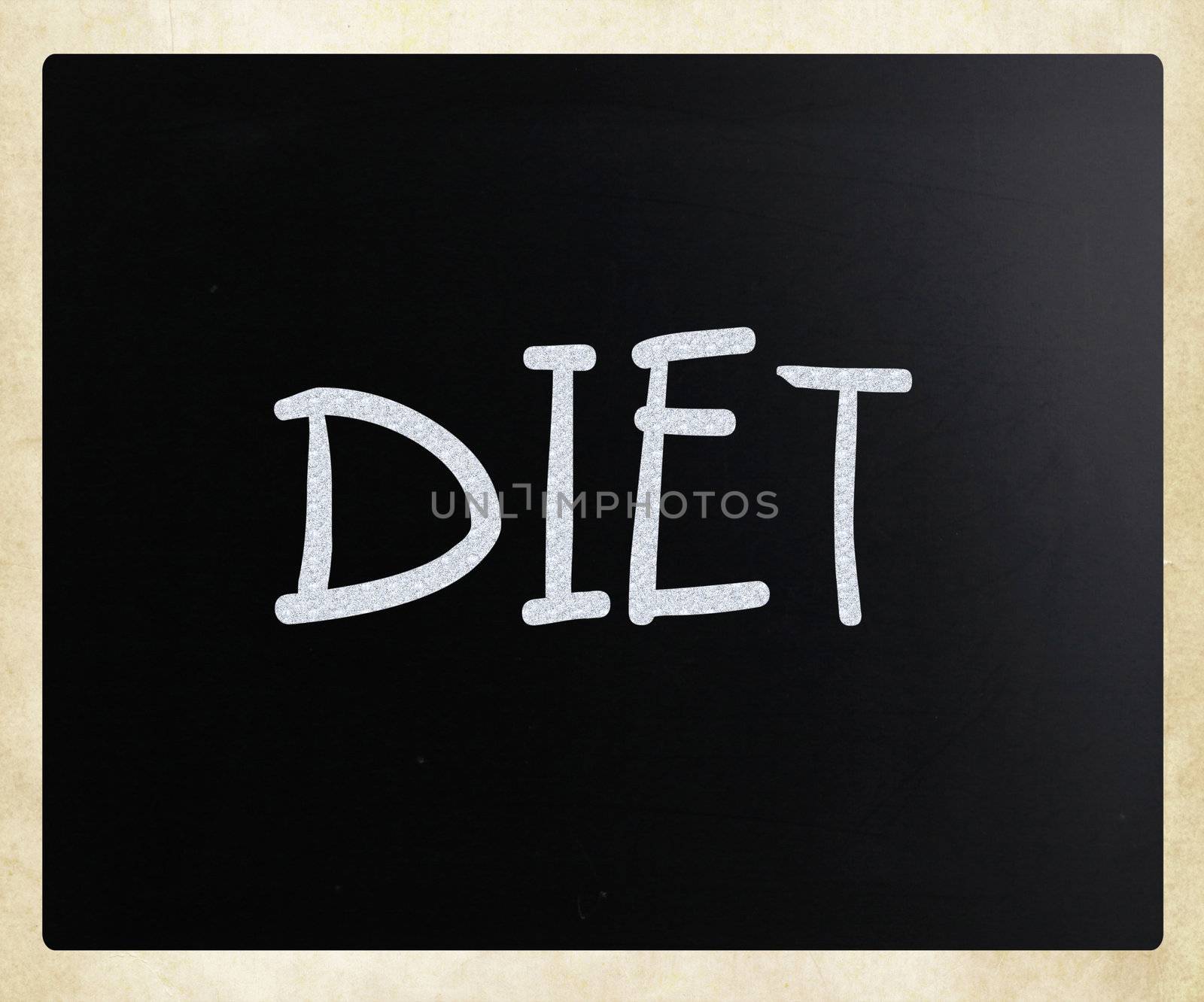 "Diet" handwritten with white chalk on a blackboard by nenov