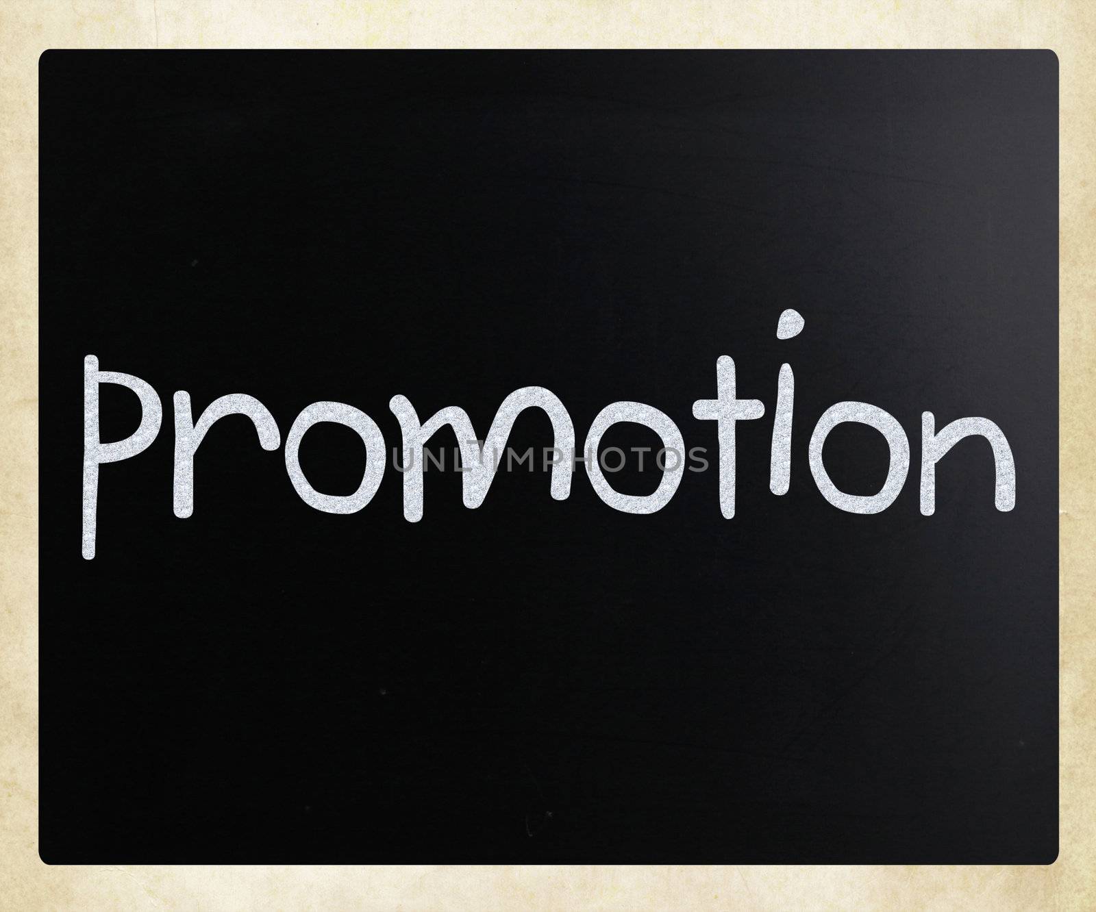 The word "promotion" handwritten with white chalk on a blackboard