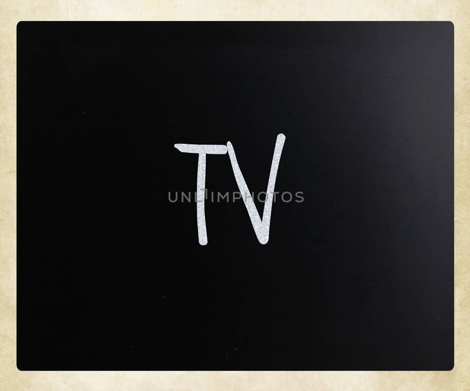 "TV" handwritten with white chalk on a blackboard