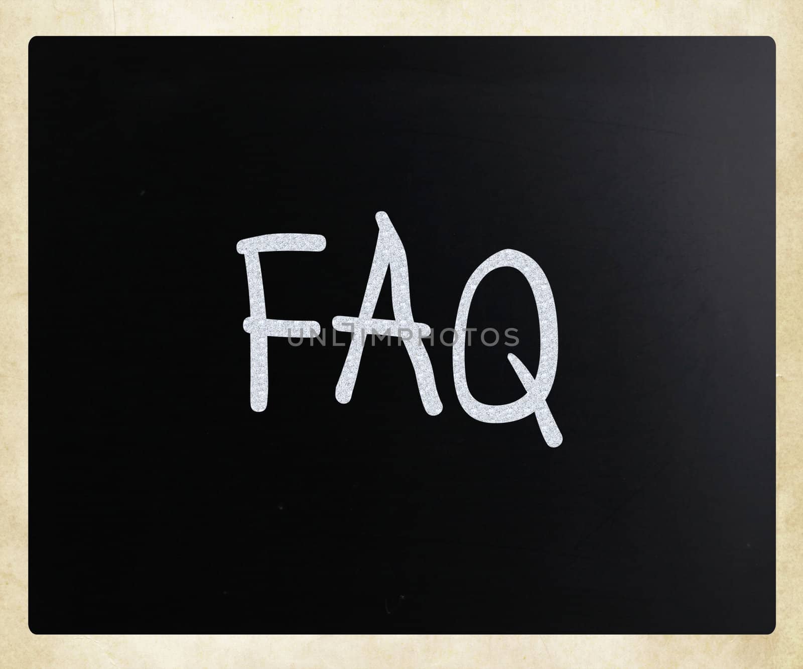 "FAQ" handwritten with white chalk on a blackboard