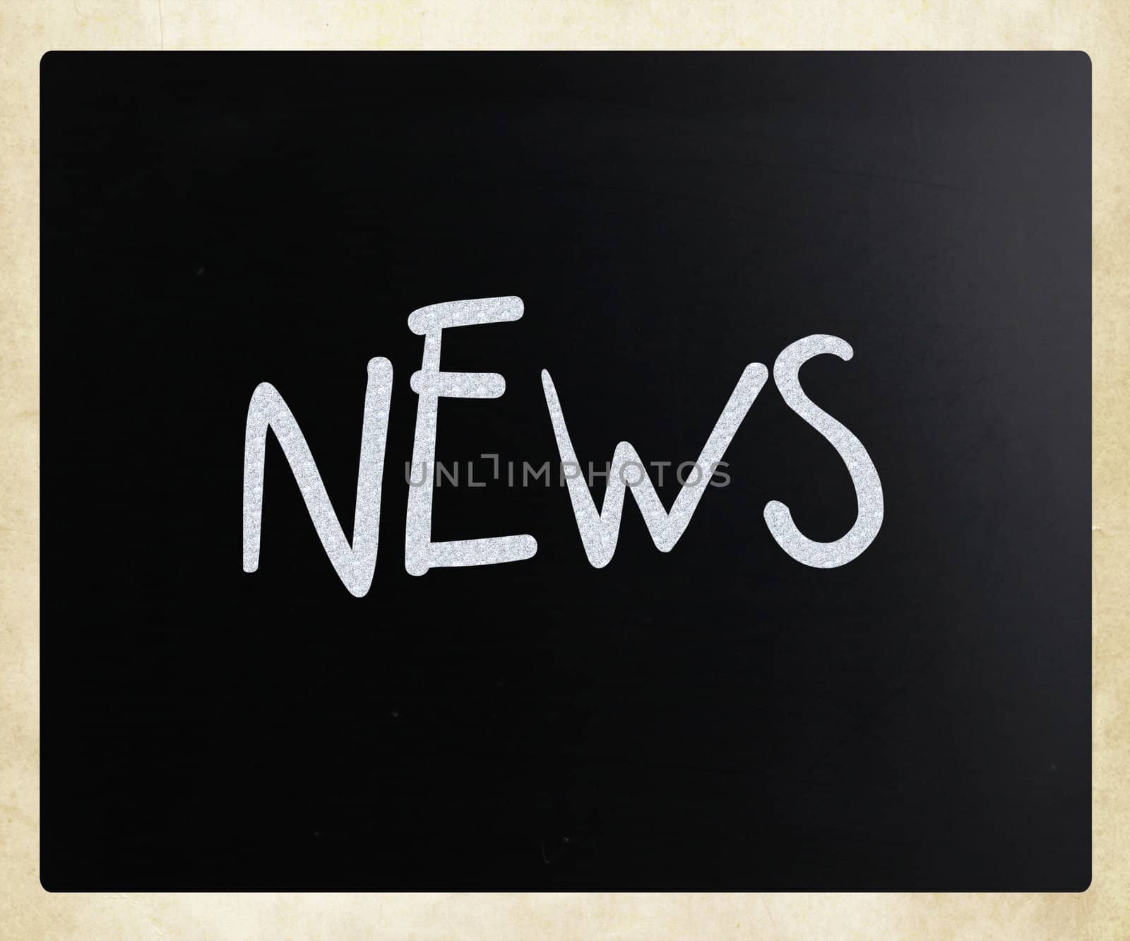 "News" handwritten with white chalk on a blackboard