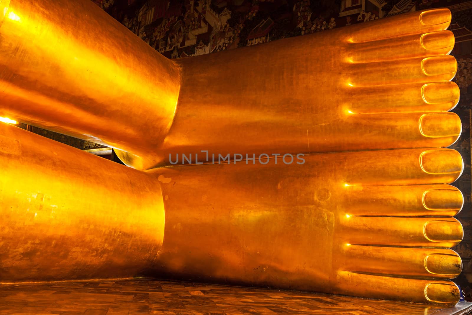 Reclining gold Buddha statue feet, Thailand by dimol