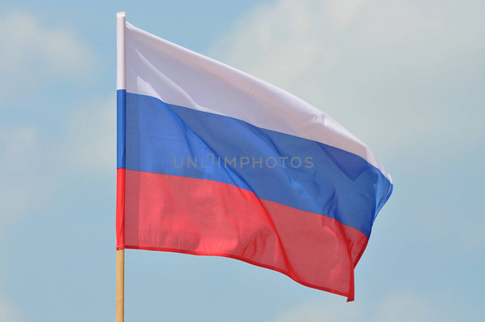 Flag of Russian Federation against blue sky