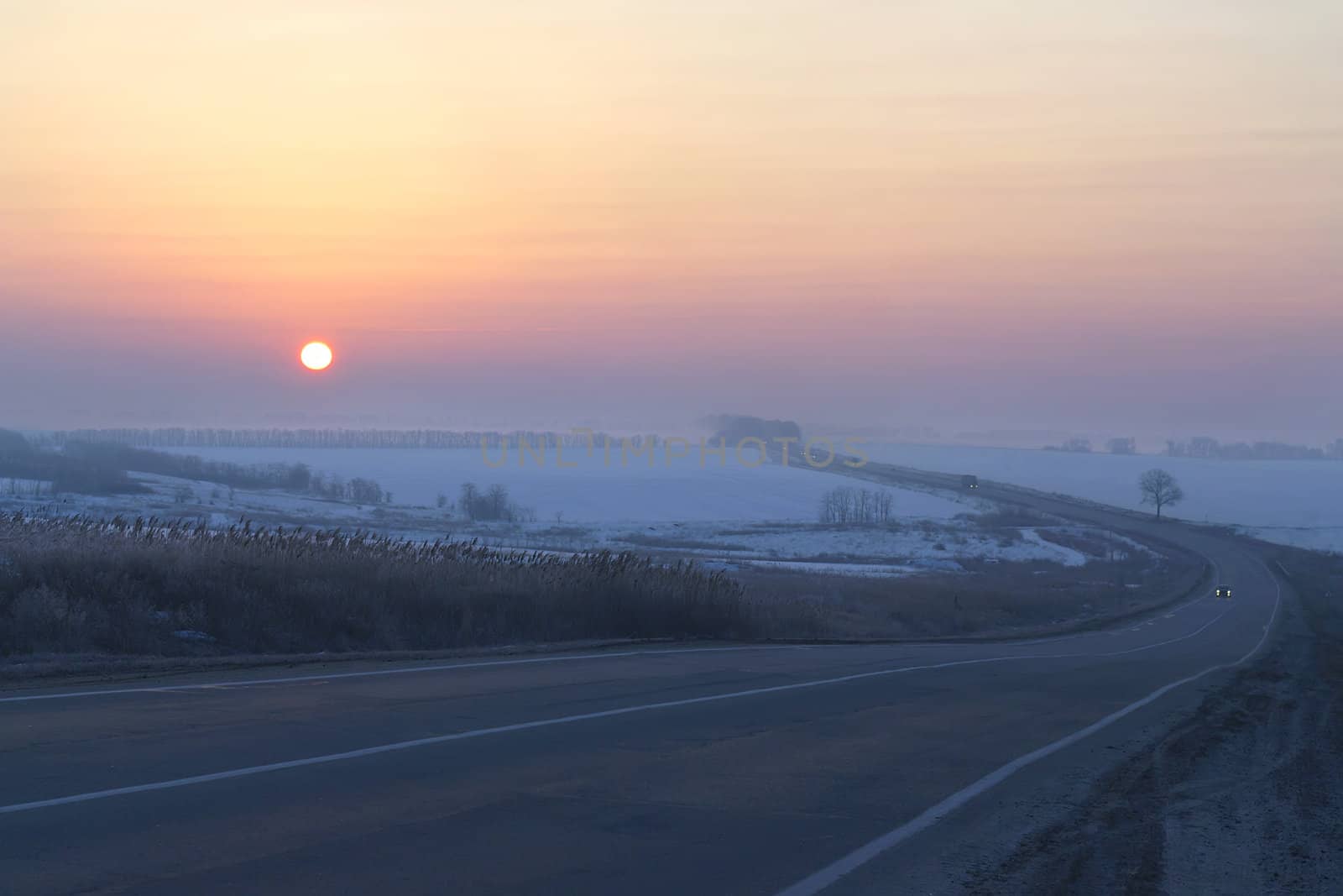 sunrise on the winter road