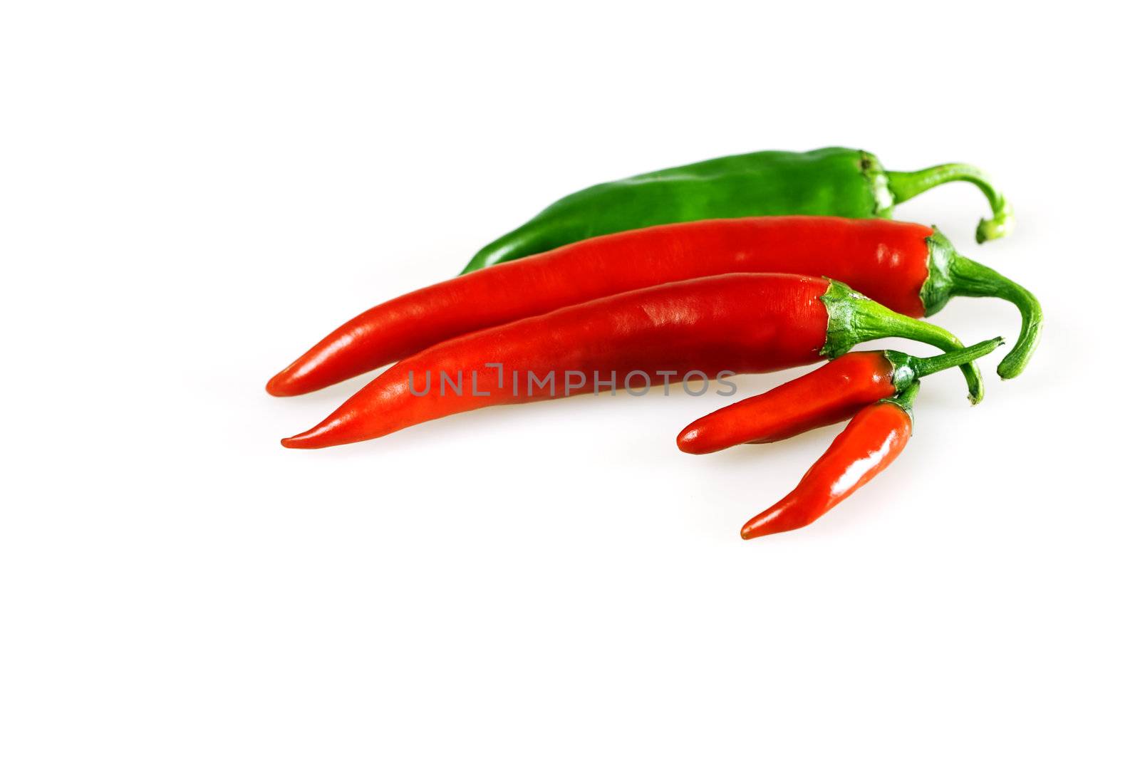 Red and green chilly pepper on a white background