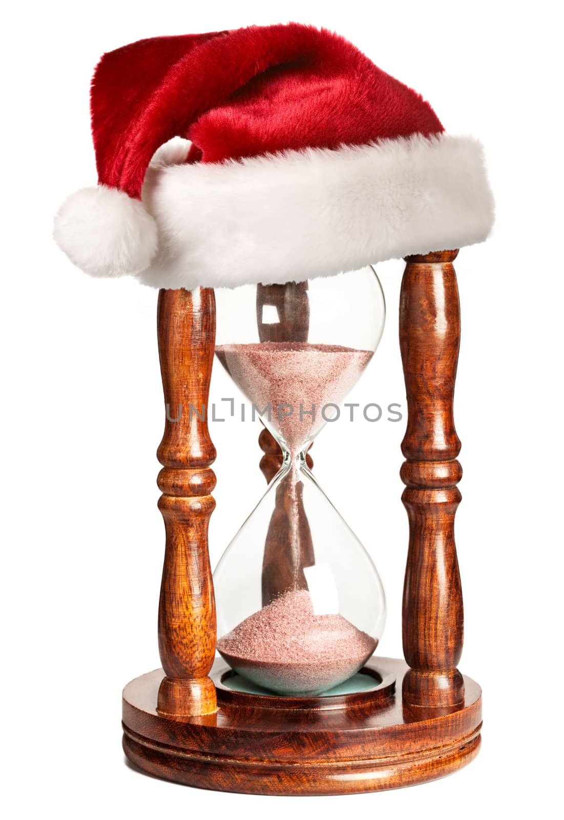 Christmas is coming concept - hourglass  with Santa Claus hat isolated on white background