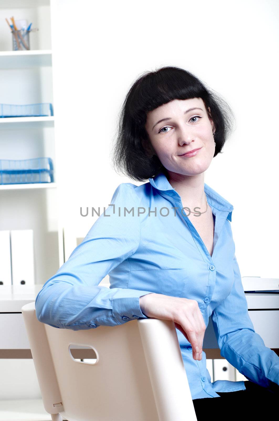 Businesswoman works at office by adam121