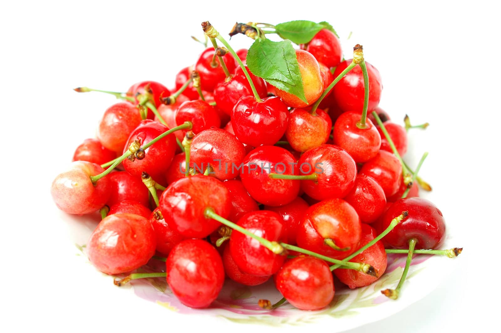 Fresh red ripe cherry fruits on a white background