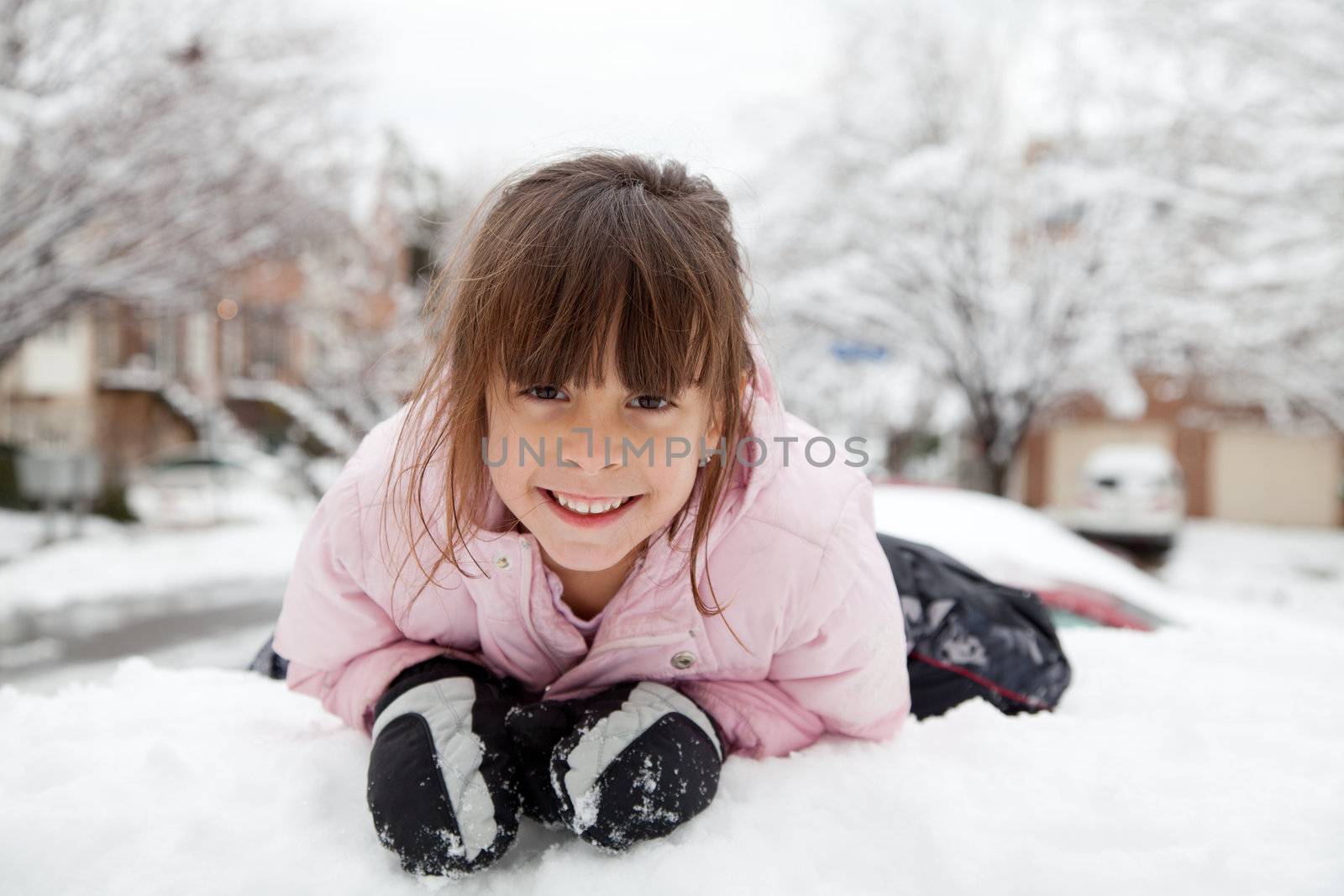 Little girl playing in the snow