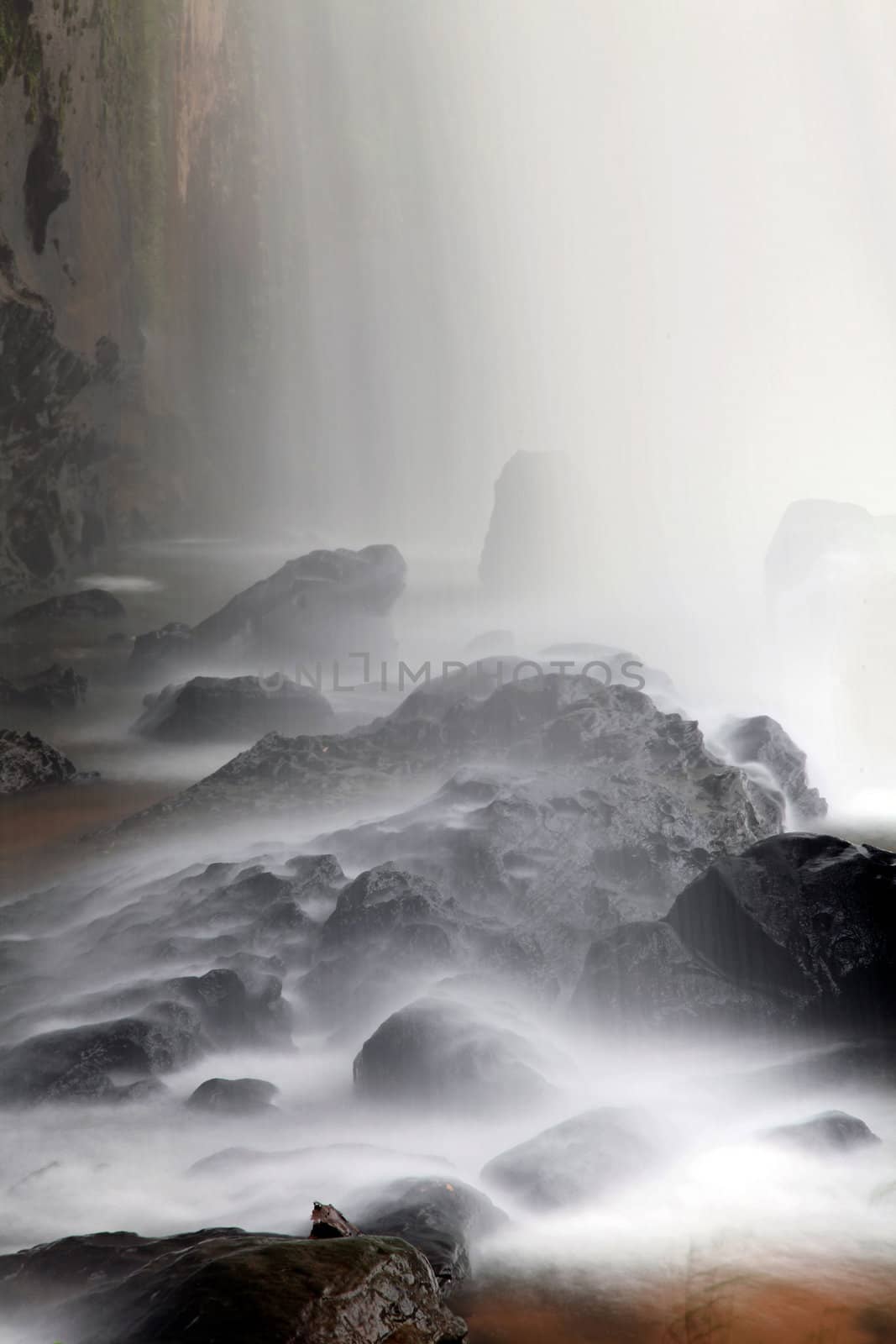 closeup of waterfall on the rock in forest