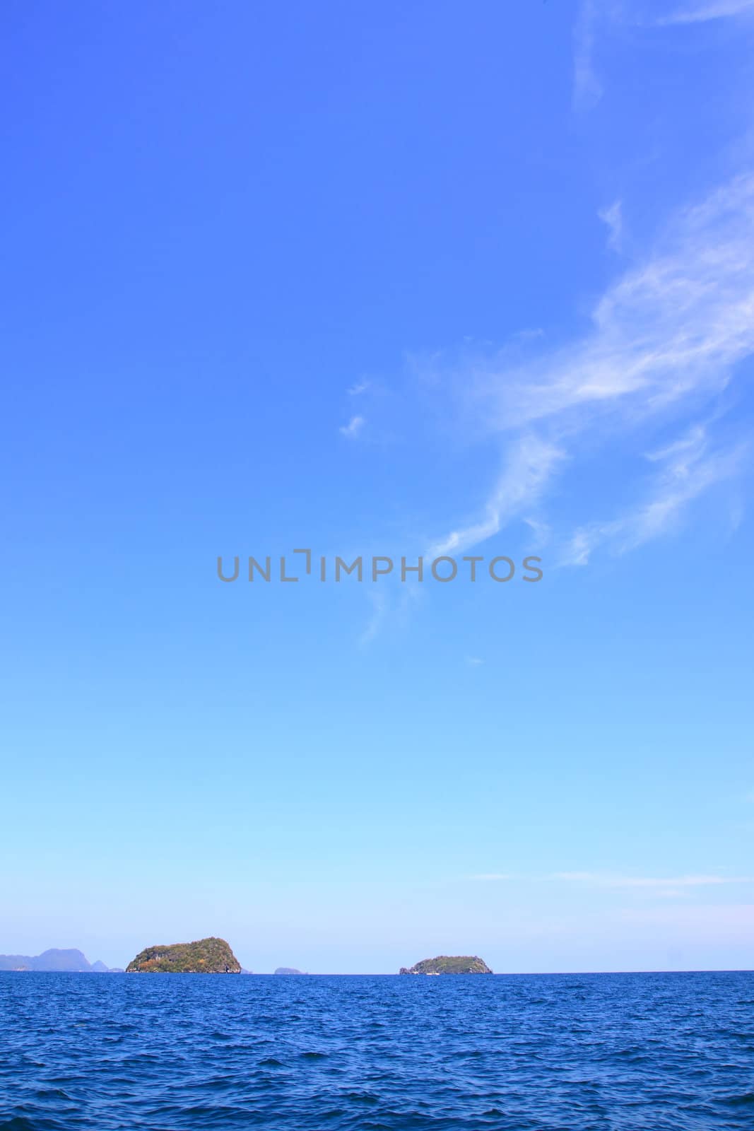 Small island with sunny and blue sky in summer