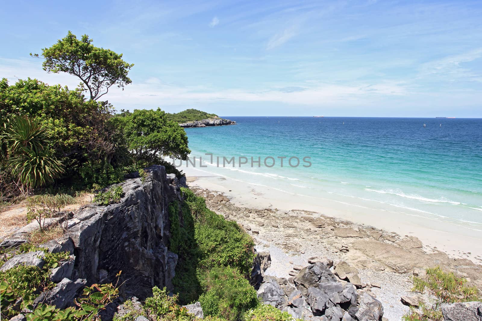 aerial view of beautiful white sand beach with cliff in sunny day