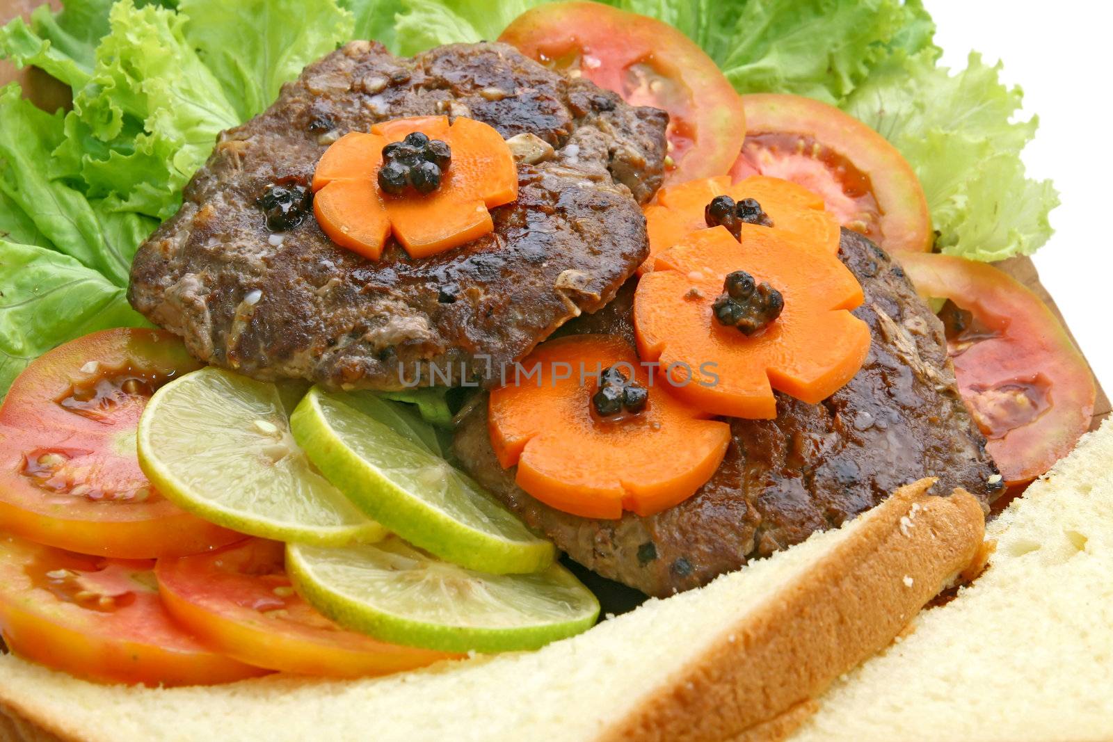 Closeup of Grill Beef Hamburger with vegetable and bread.
