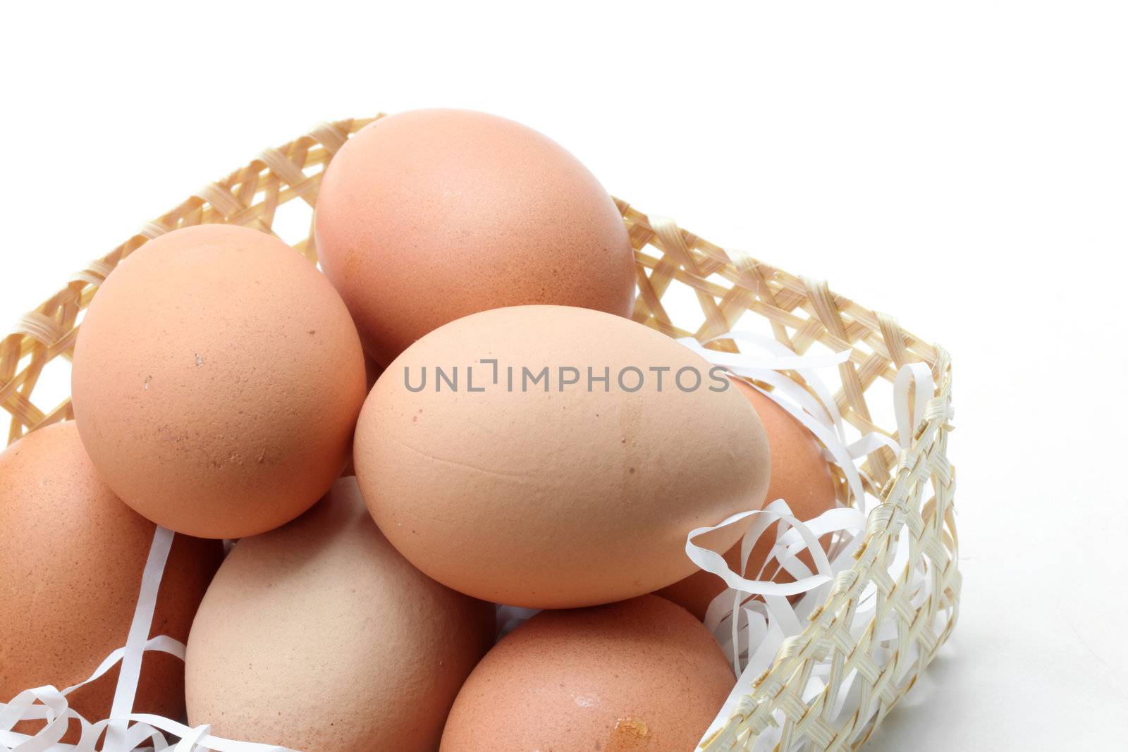 egg in a basket isolated on a white background