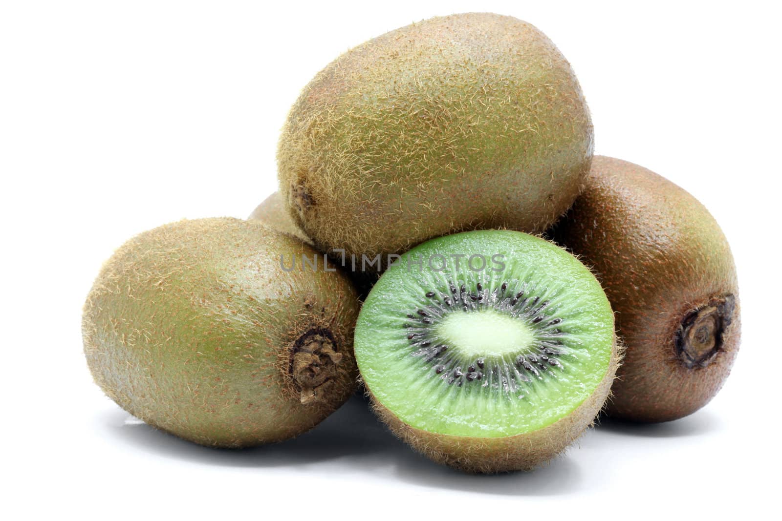 half and whole Kiwi fruit on white background