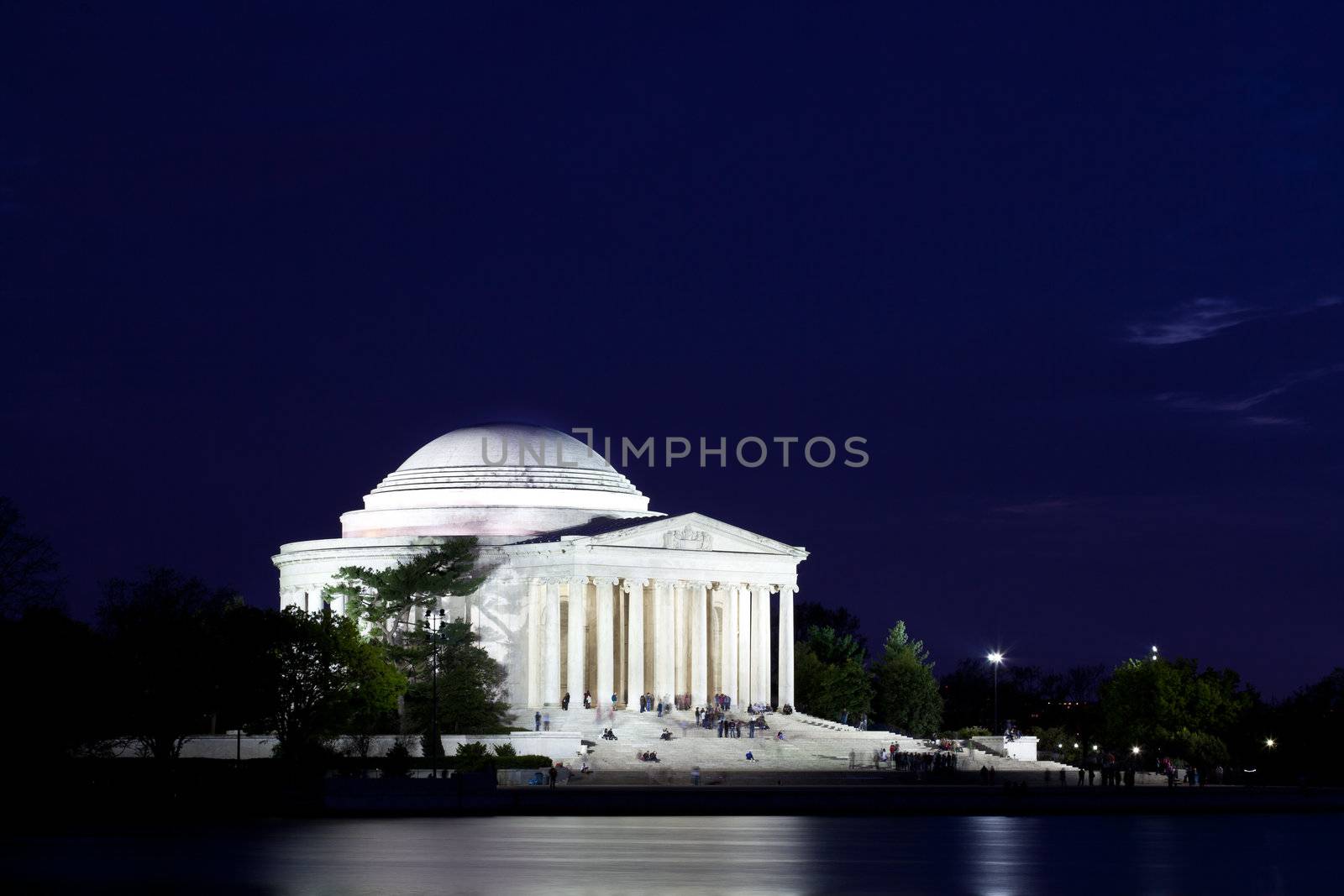 Thomas Jefferson Memorial with reflecting in the Tidal Basin in Washington DC at dusk shortly after sunset with dramatic skies