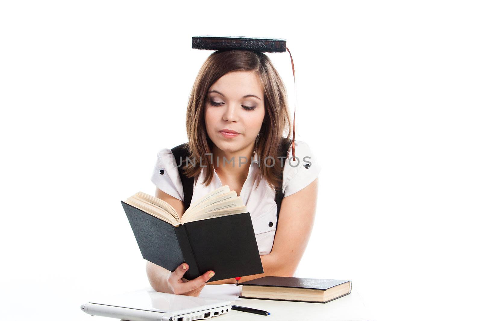 Portrait of a young and beautiful girl student who is preparing for exams