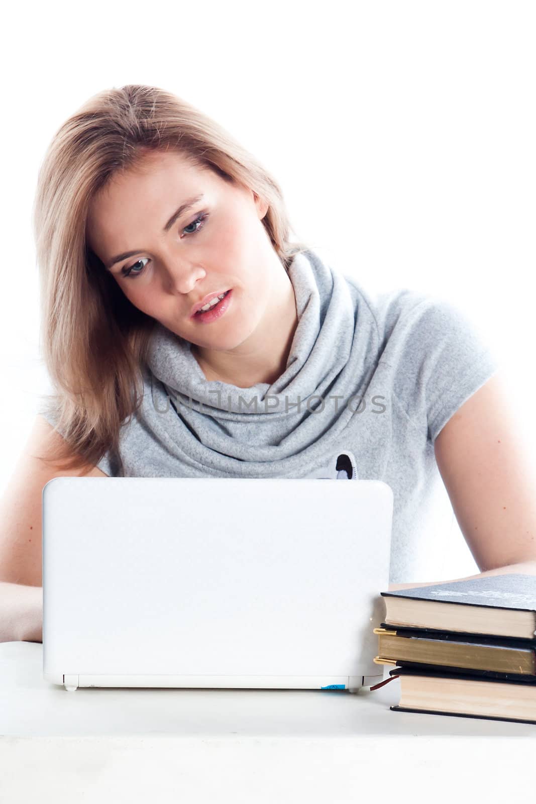 Portrait of a young and beautiful girl student who is preparing for exams