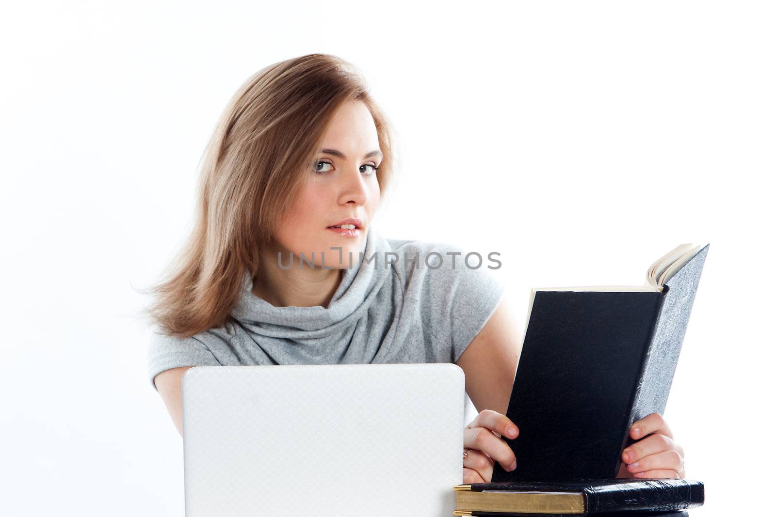 Portrait of a young and beautiful girl student who is preparing for exams