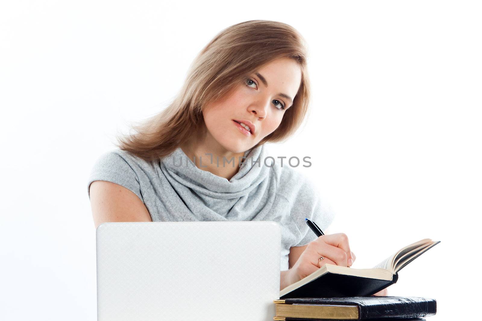 Portrait of a young and beautiful girl student who is preparing for exams