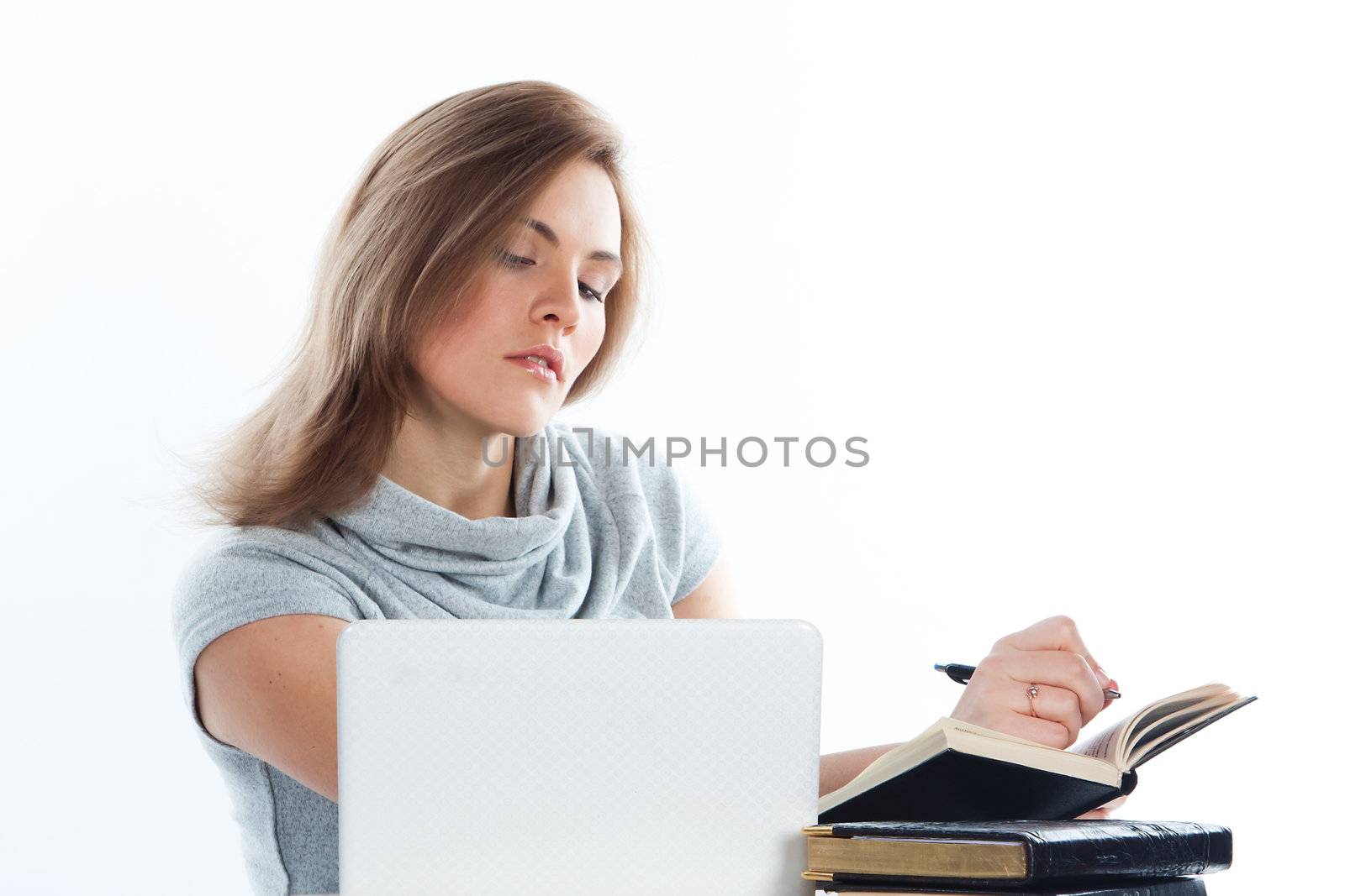 Portrait of a young and beautiful girl student who is preparing for exams