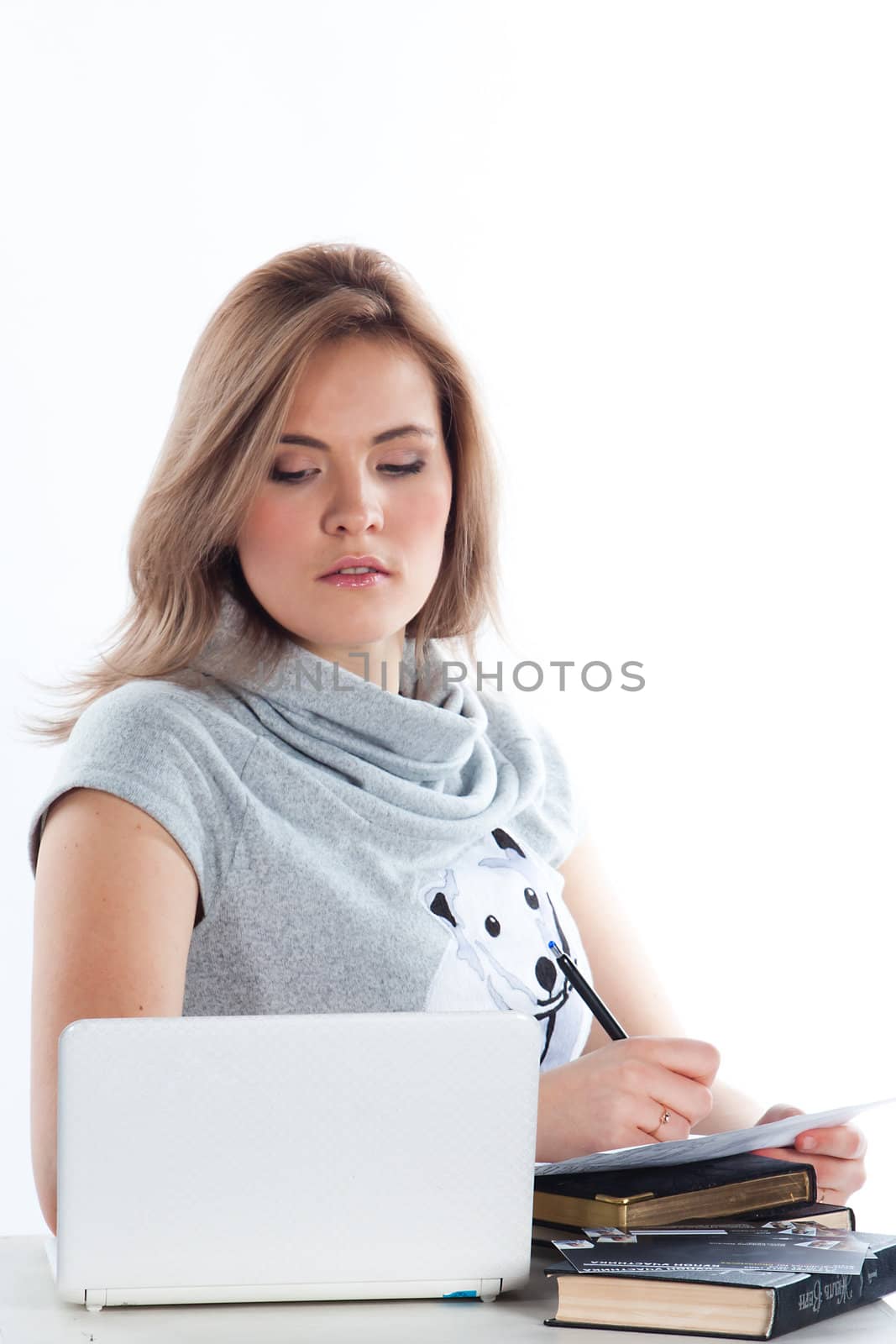 Portrait of a young and beautiful girl student who is preparing for exams