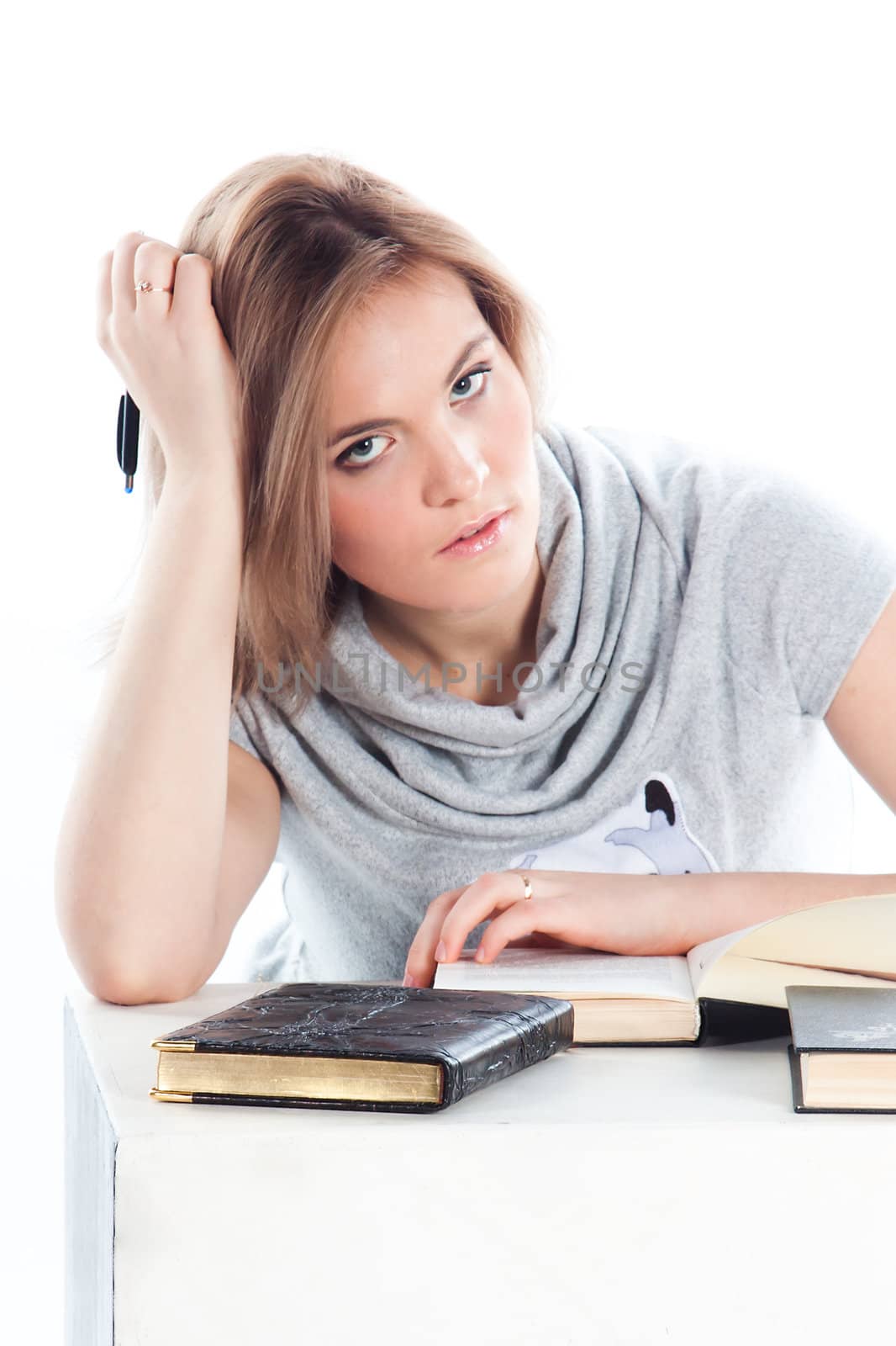 Portrait of a young and beautiful girl student who is preparing for exams