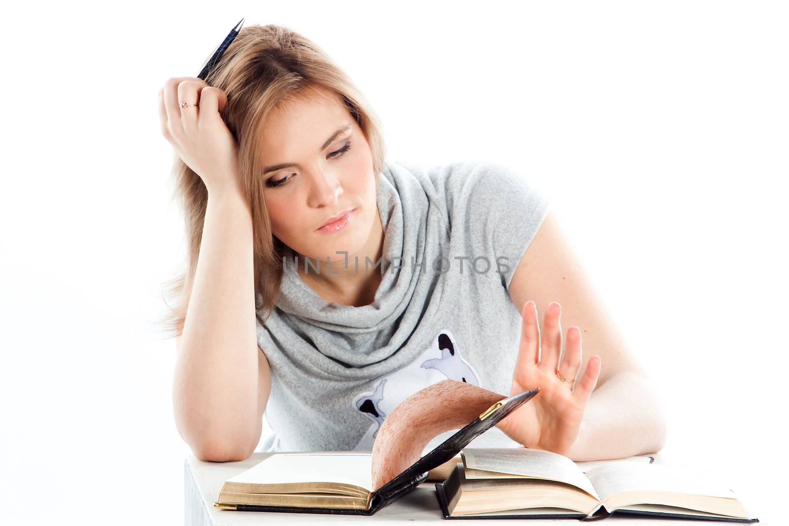 Portrait of a young and beautiful girl student who is preparing for exams