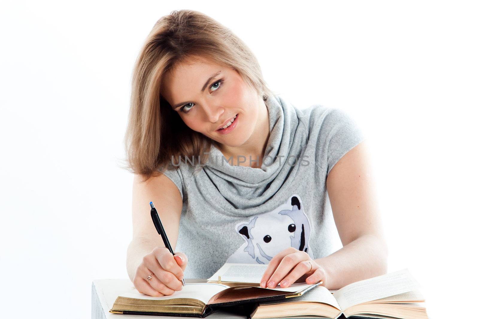 Portrait of a young and beautiful girl student who is preparing for exams