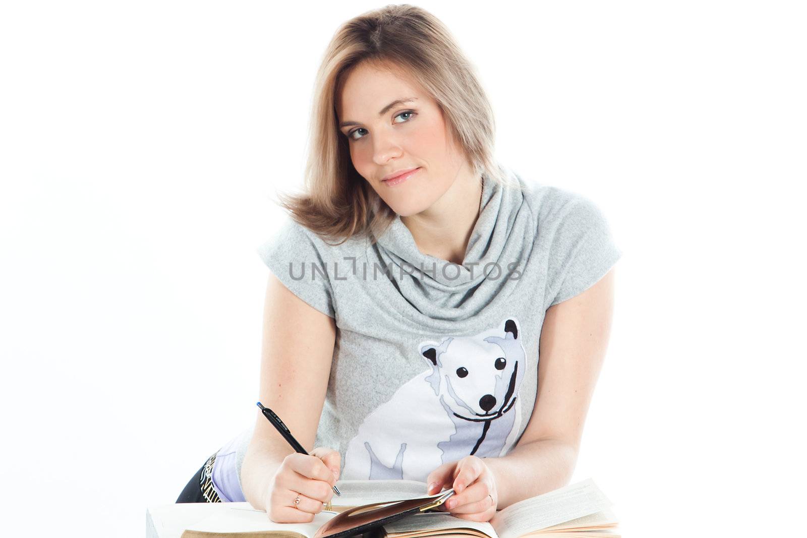 Portrait of a young and beautiful girl student who is preparing for exams