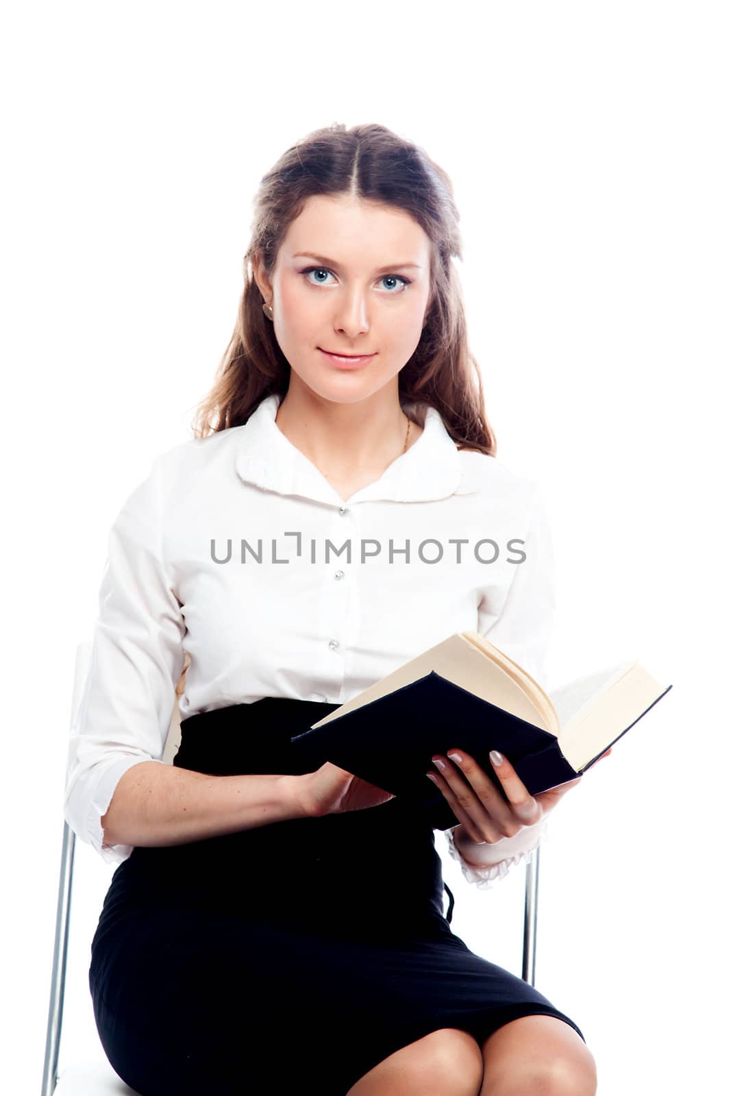 Portrait of a young and beautiful girl student who is preparing for exams