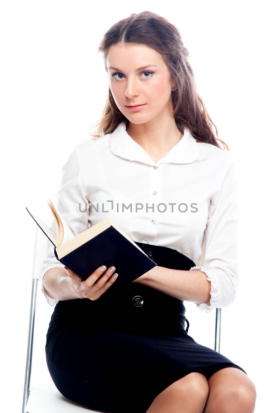 Portrait of a young and beautiful girl student who is preparing for exams