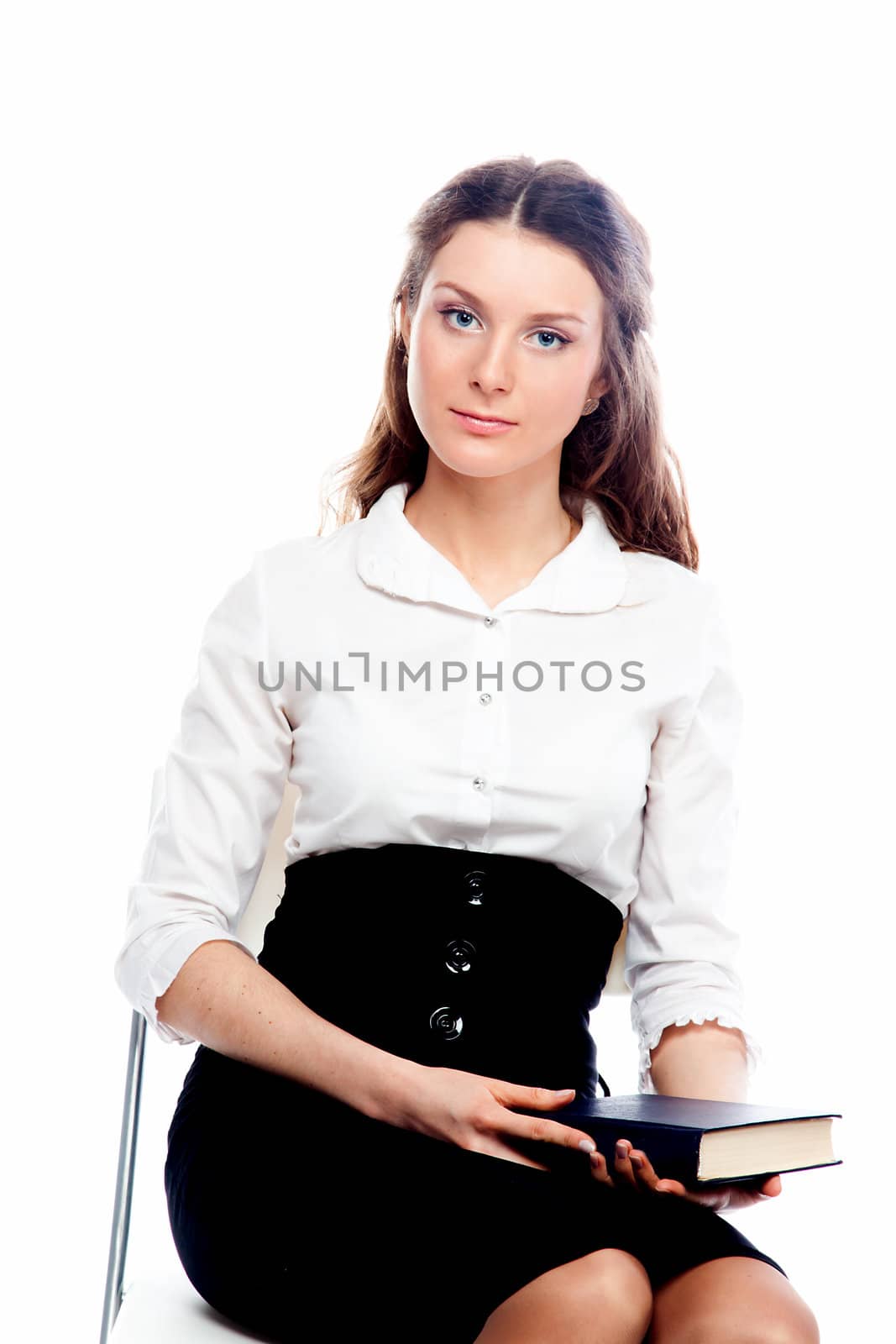 Portrait of a young and beautiful girl student who is preparing for exams