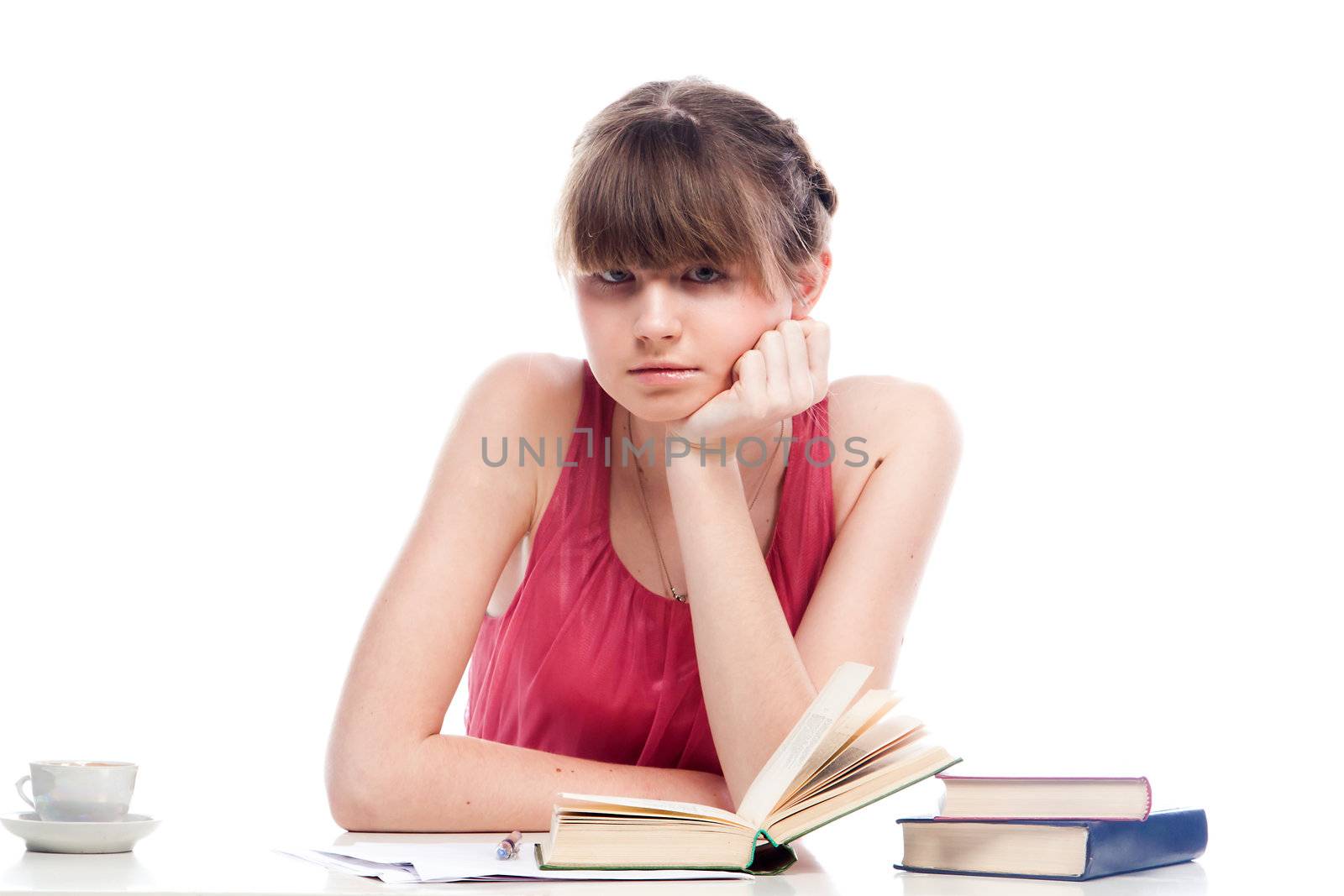 Portrait of a young and beautiful girl student who is preparing for exams