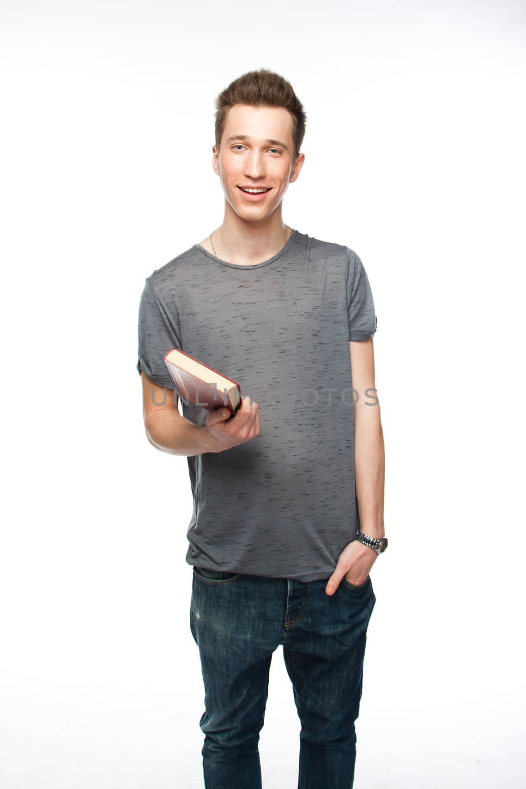 Portrait of a young attractive guy who is preparing for the exams at a university or college
