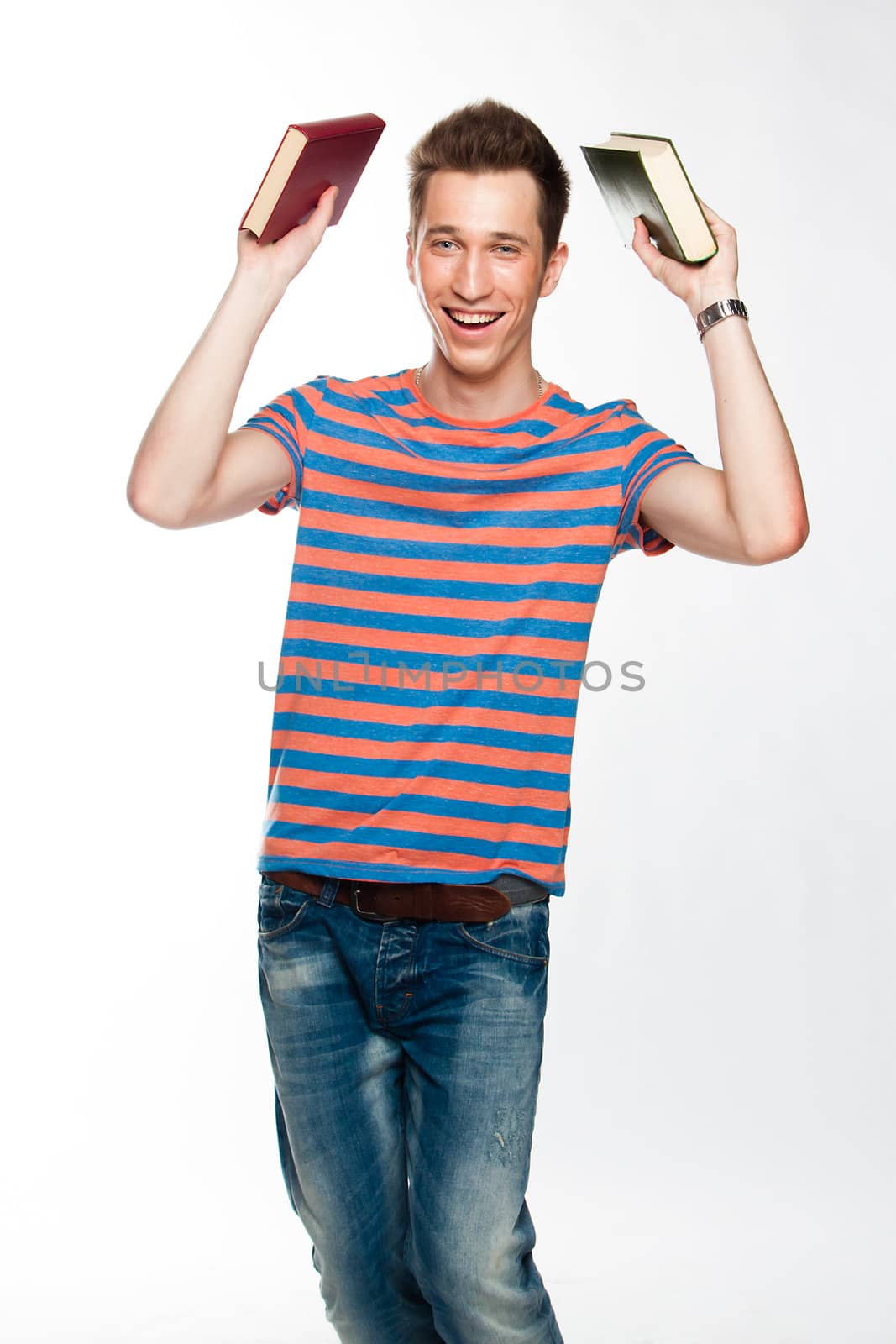 Portrait of a young attractive guy who is preparing for the exams at a university or college
