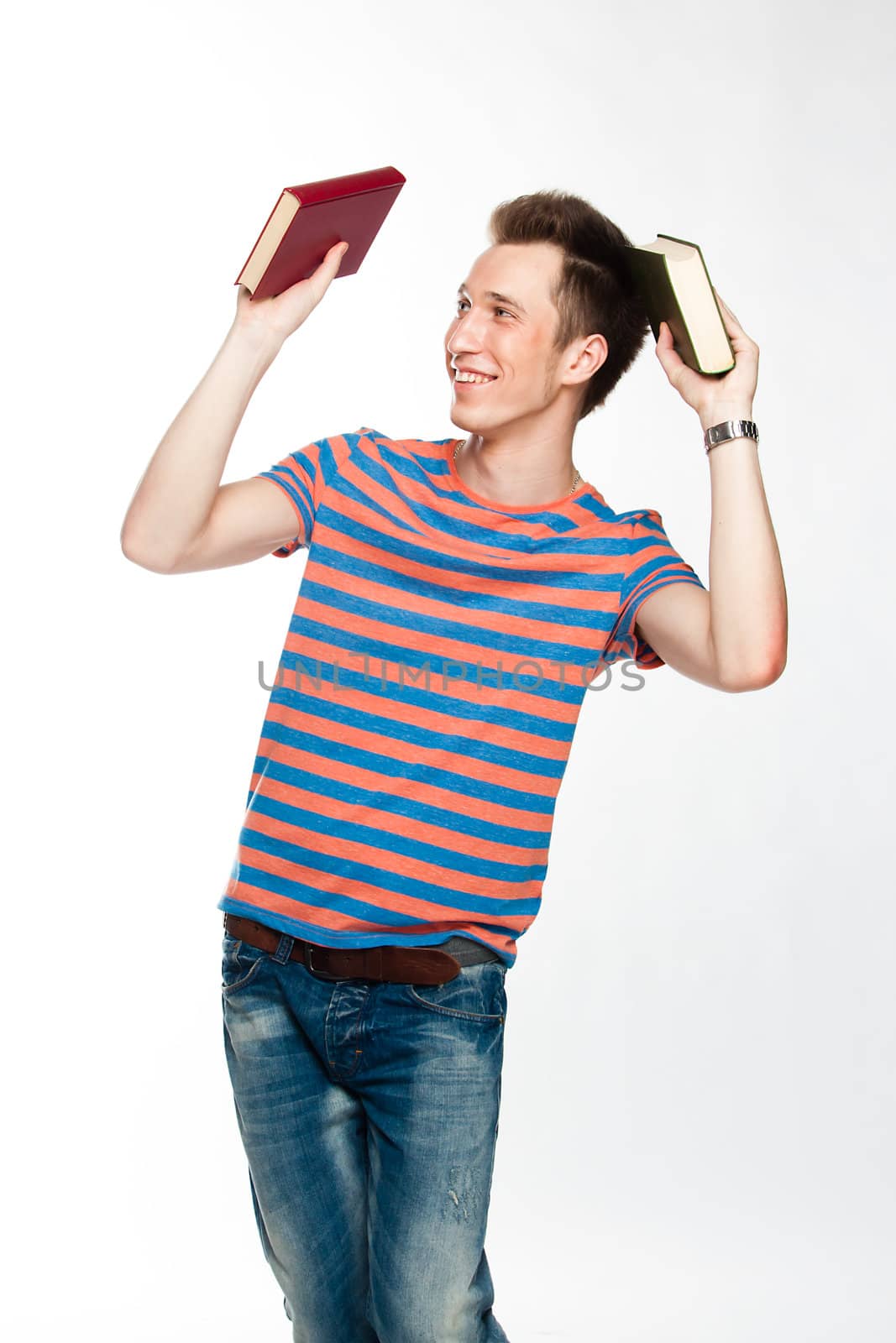 Portrait of a young attractive guy who is preparing for the exams at a university or college