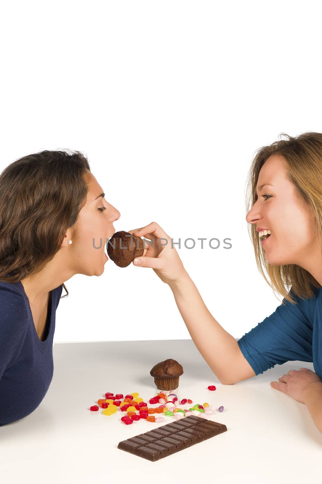 Biting into a muffin, a sweet treat