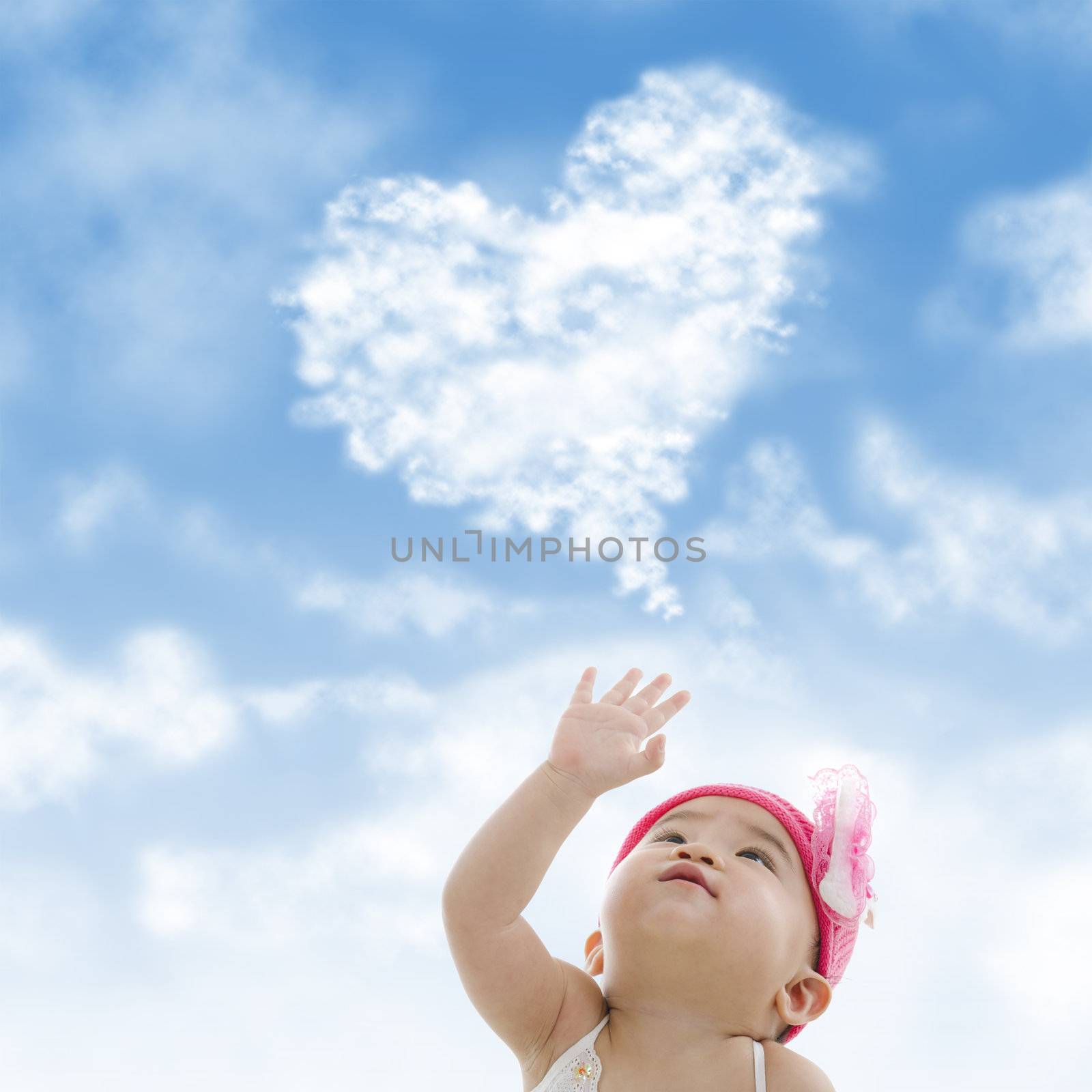 Baby girl hand towards sky