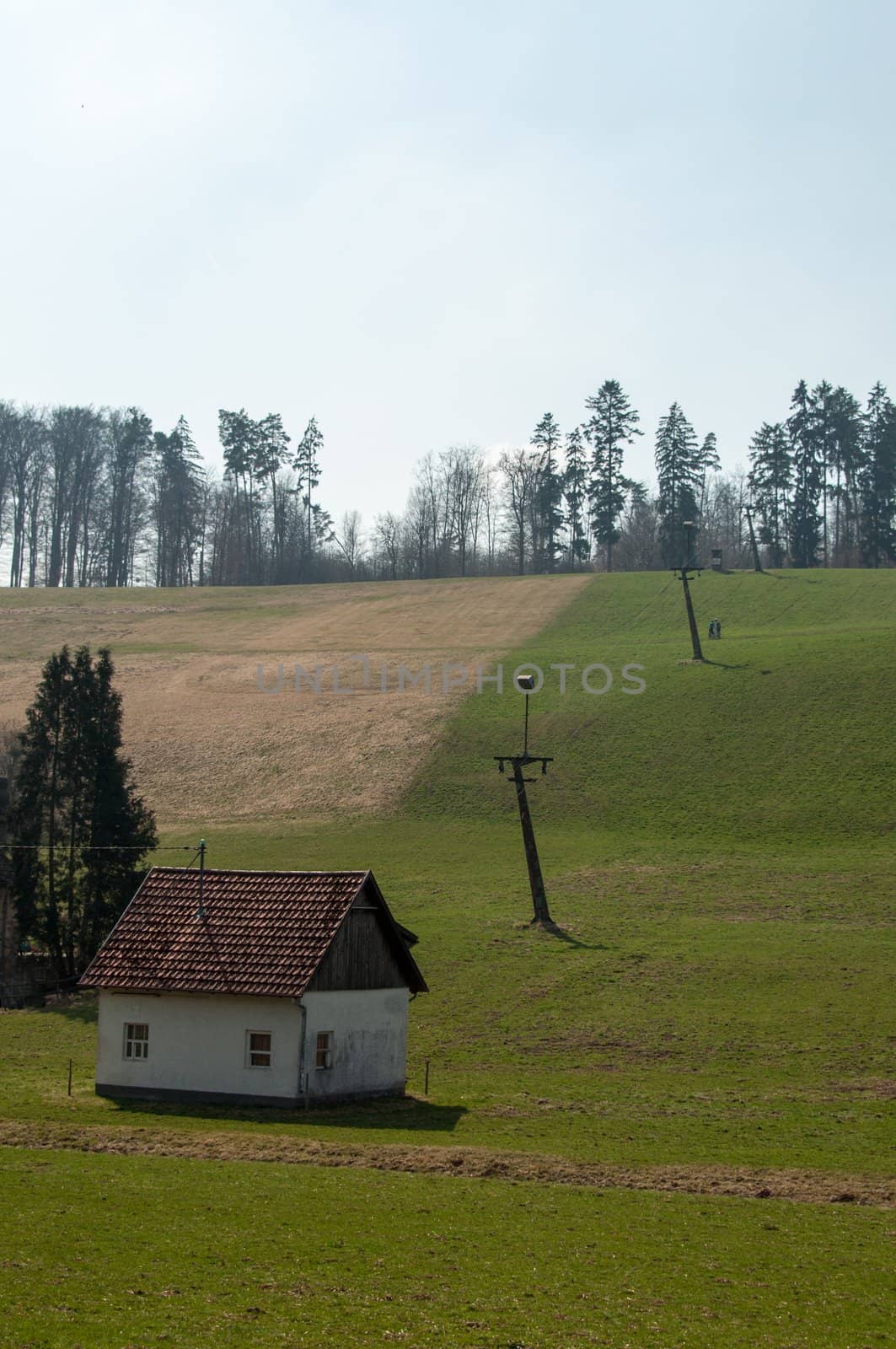skilift in the mountains on a green lawn during the summer with valley station