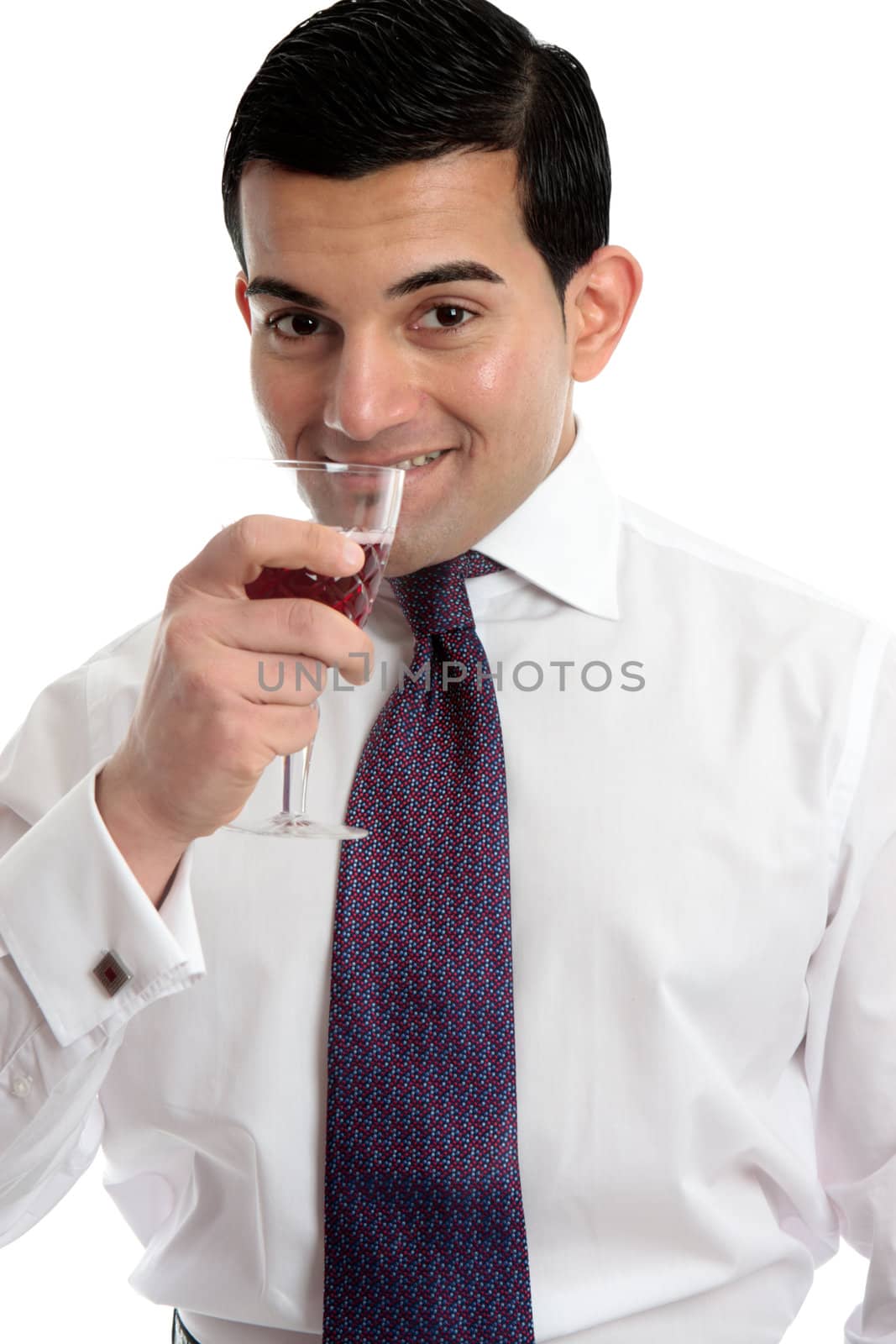 A man drinks wine from a wine glass.  White background.